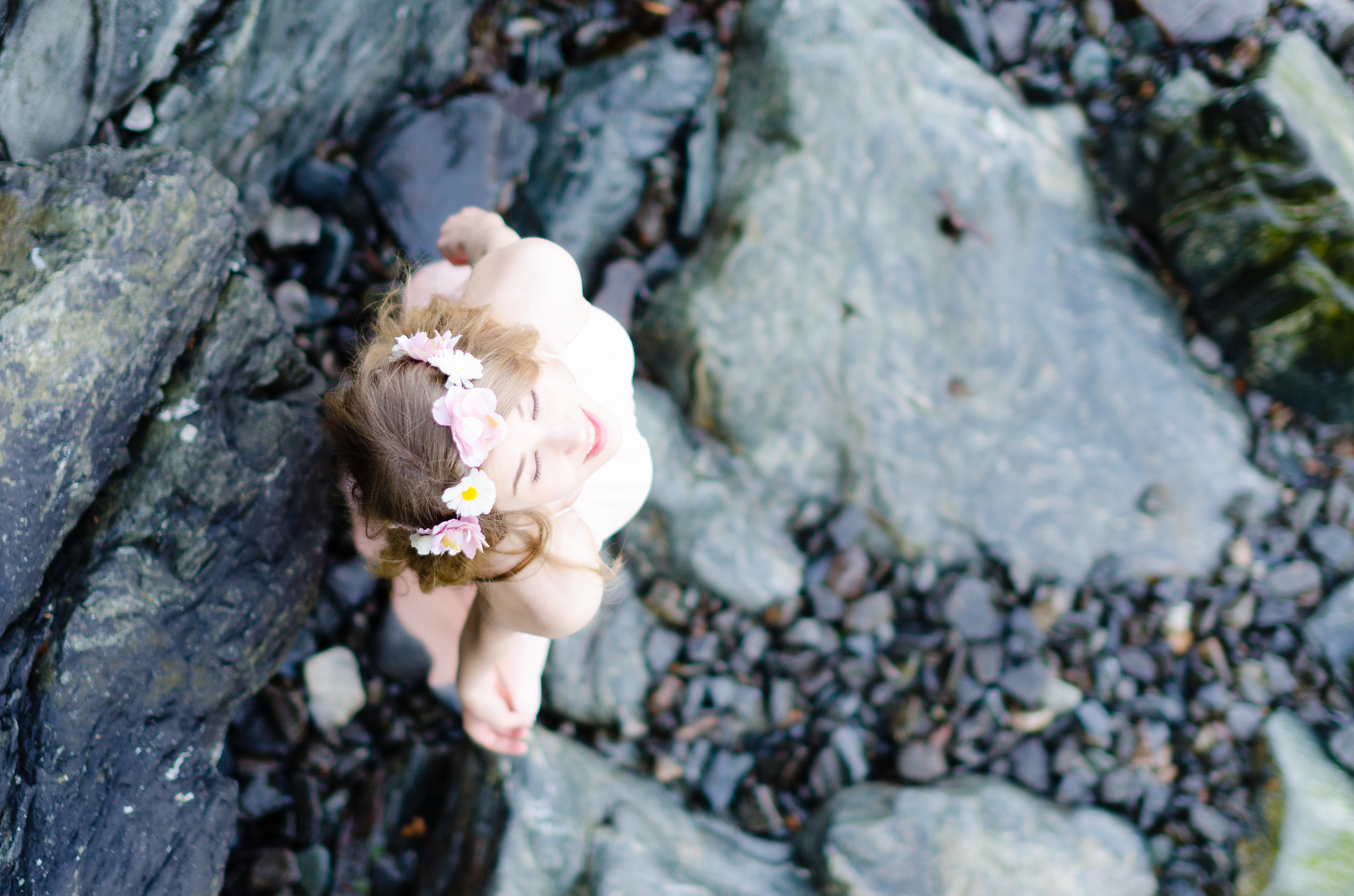 Nikon D7000 + Sigma 50mm F1.4 EX DG HSM sample photo. Female model in pink dress standing on rocks photography