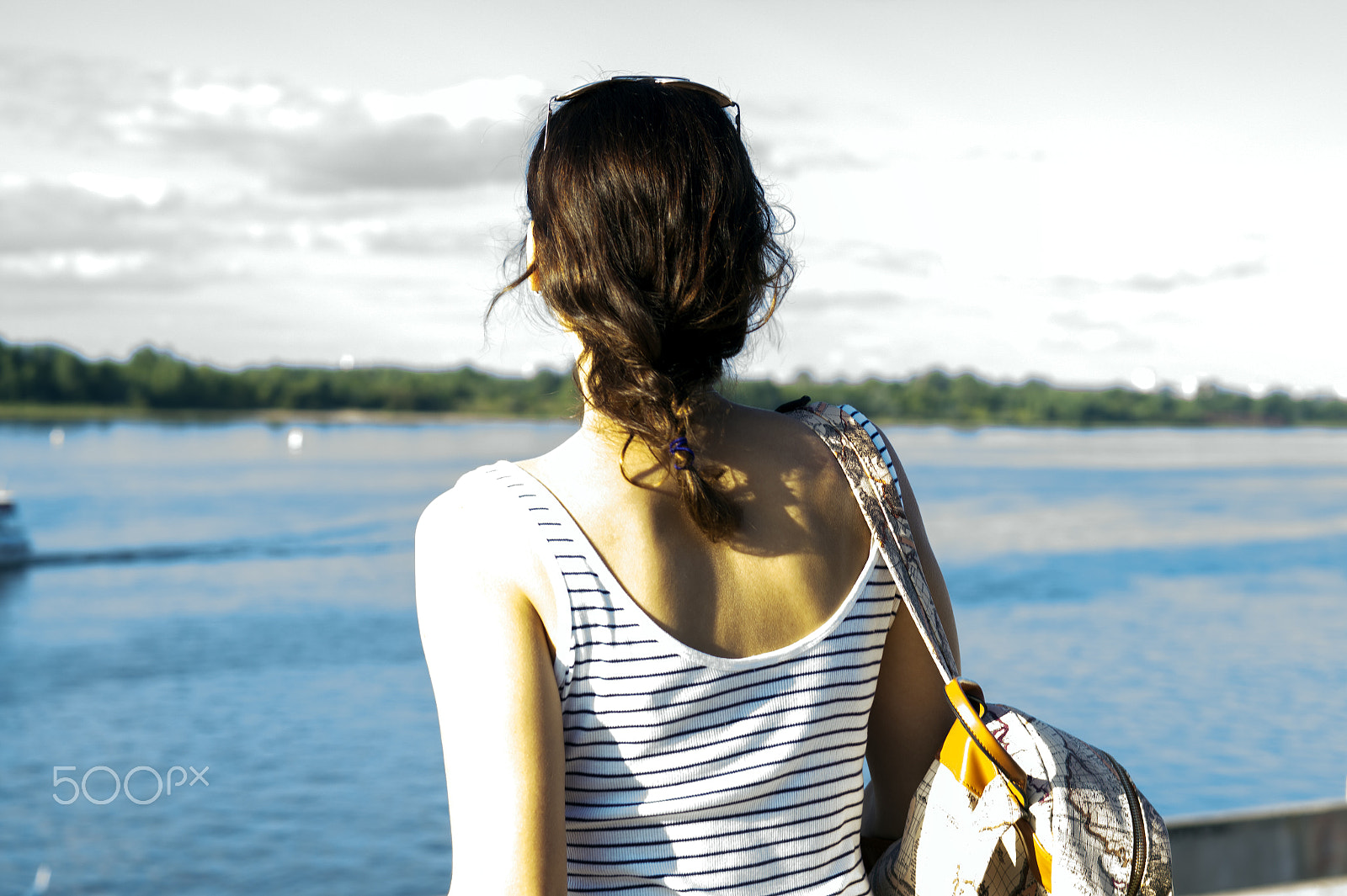 Sony SLT-A58 + Sony 50mm F1.4 sample photo. Young lonely girl with backpack standing on coast of river photography