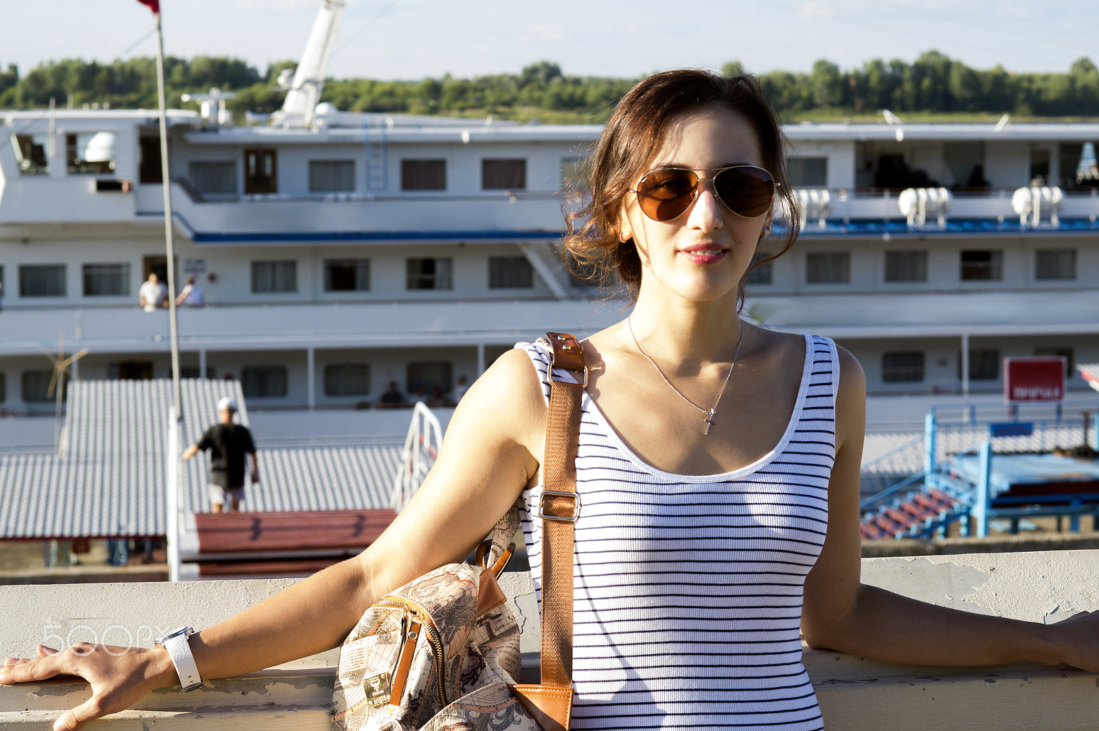 Sony SLT-A58 + Sony 50mm F1.4 sample photo. Beautiful girl with bag on shoulder  background of ship photography