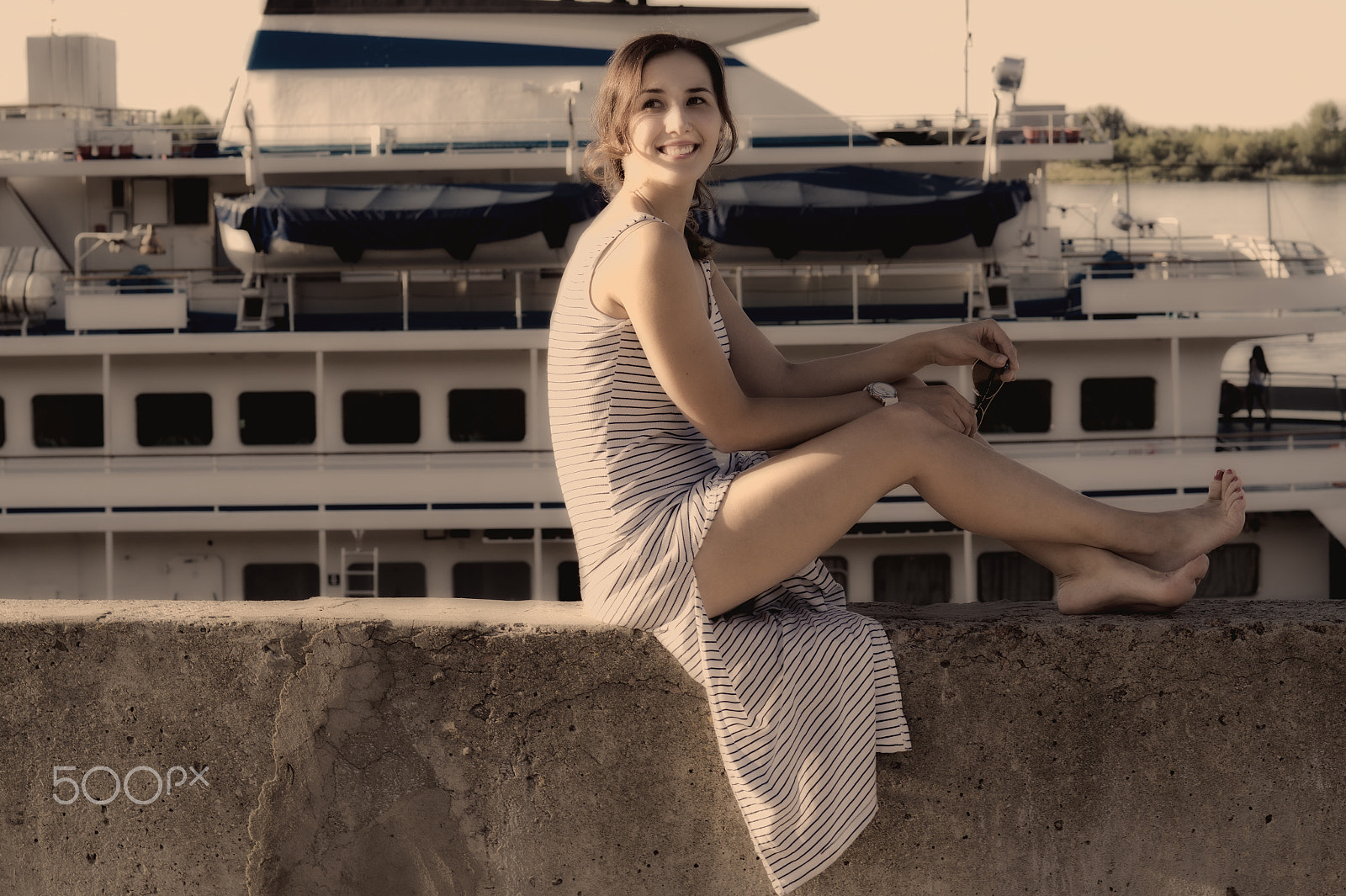 Sony SLT-A58 + Sony 50mm F1.4 sample photo. Sexy girl sits and looking up on background of ship photography