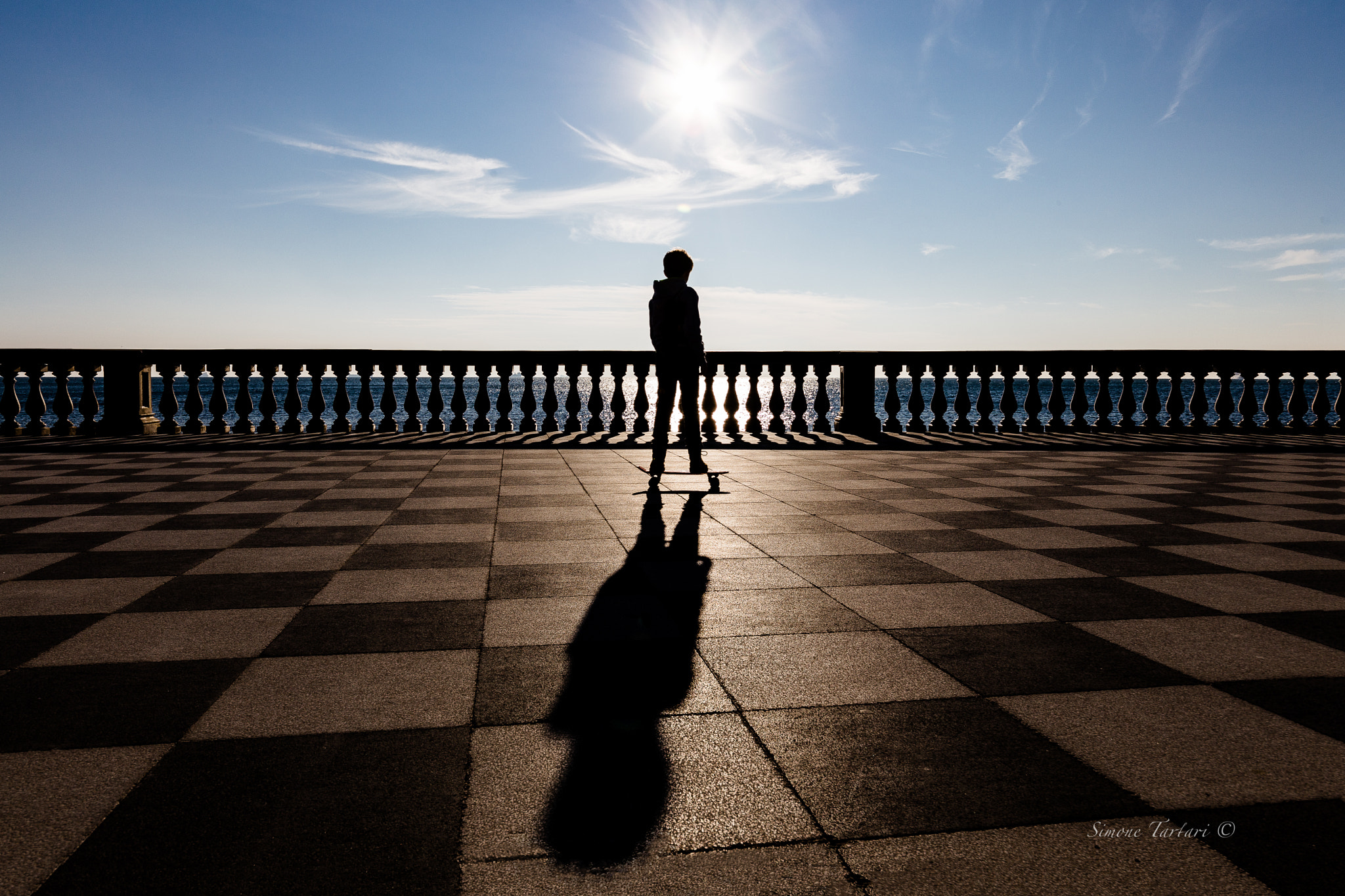 Sigma 12-24mm F4.5-5.6 II DG HSM sample photo. Skaters against the sun photography