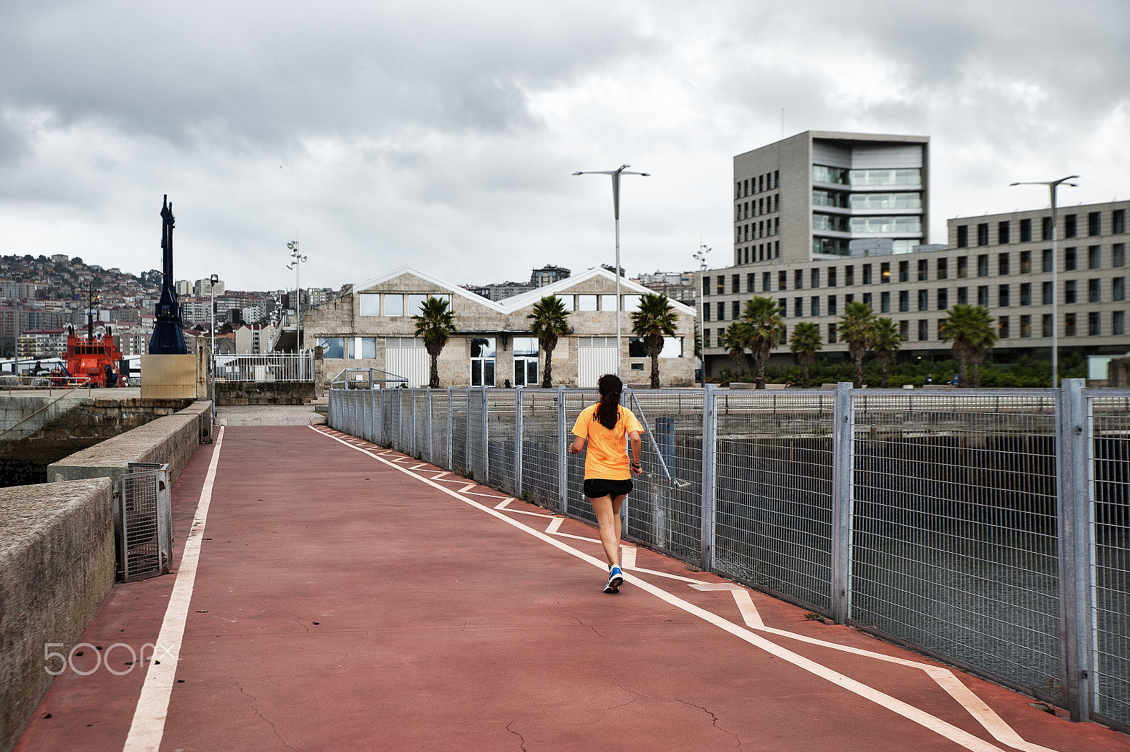 Tamron SP 24-70mm F2.8 Di VC USD sample photo. A woman does sport running in the city photography