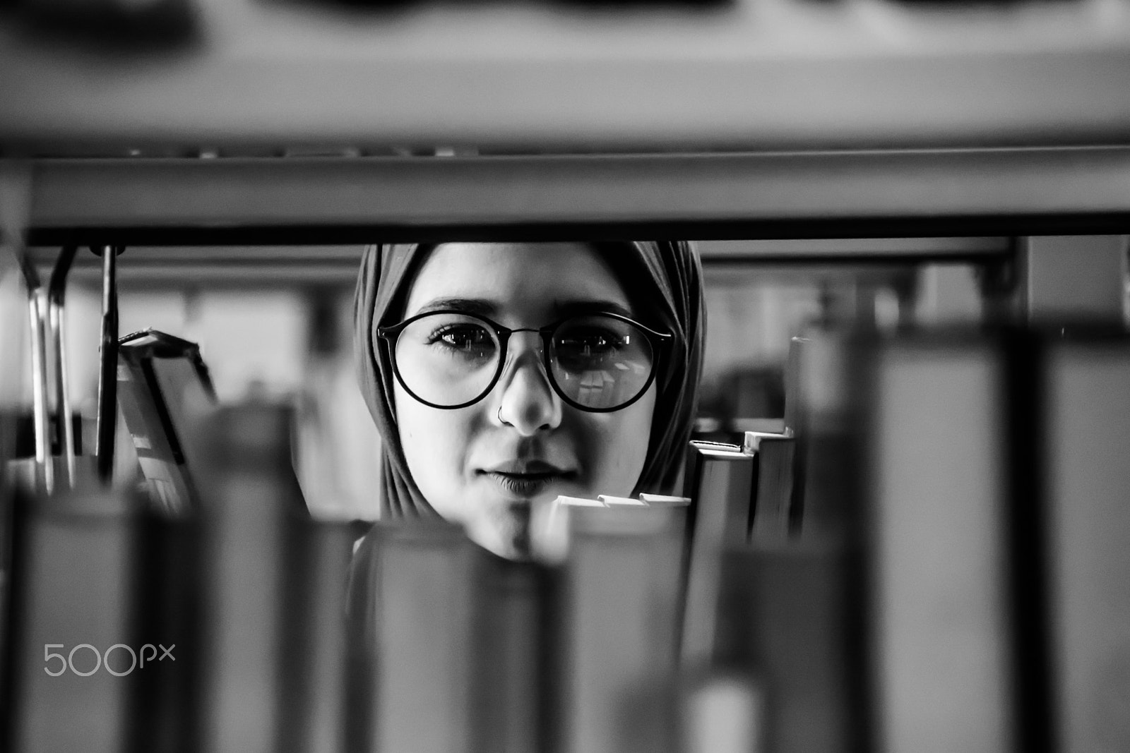 Sigma 18-250mm F3.5-6.3 DC OS HSM sample photo. A look through books photography