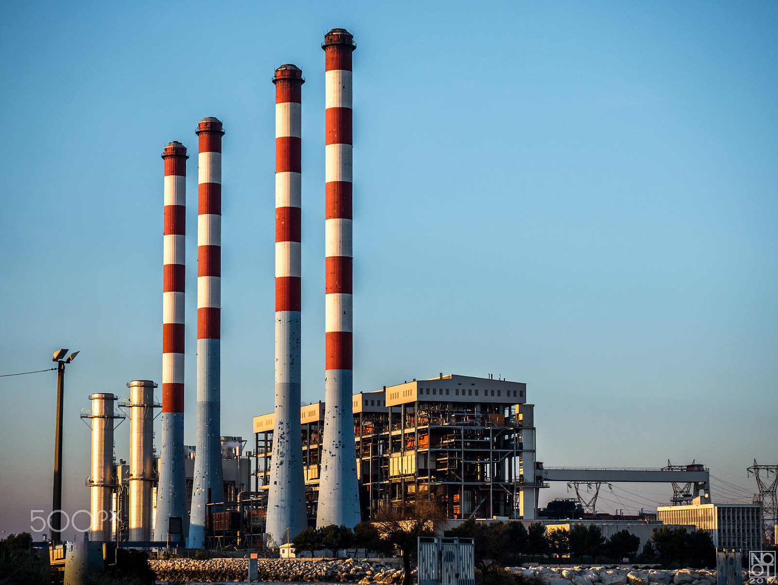 Panasonic Lumix DMC-GX7 sample photo. Four red and white chimneys #2 photography