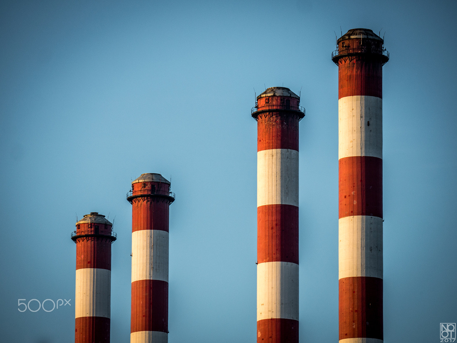 Panasonic Lumix DMC-GX7 sample photo. Four red and white chimneys #4 photography