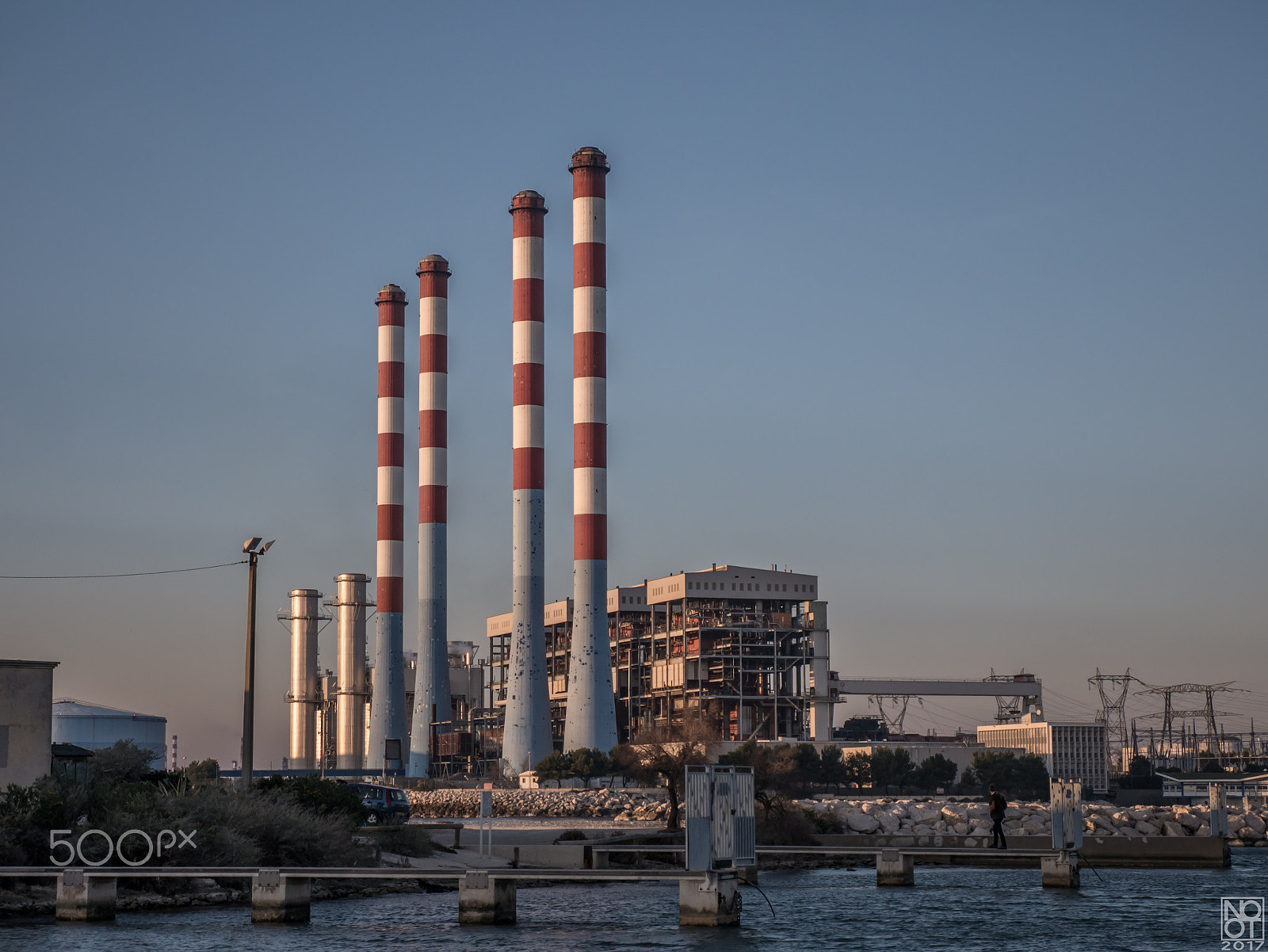 Panasonic Lumix DMC-GX7 sample photo. Four red and white chimneys #1 photography