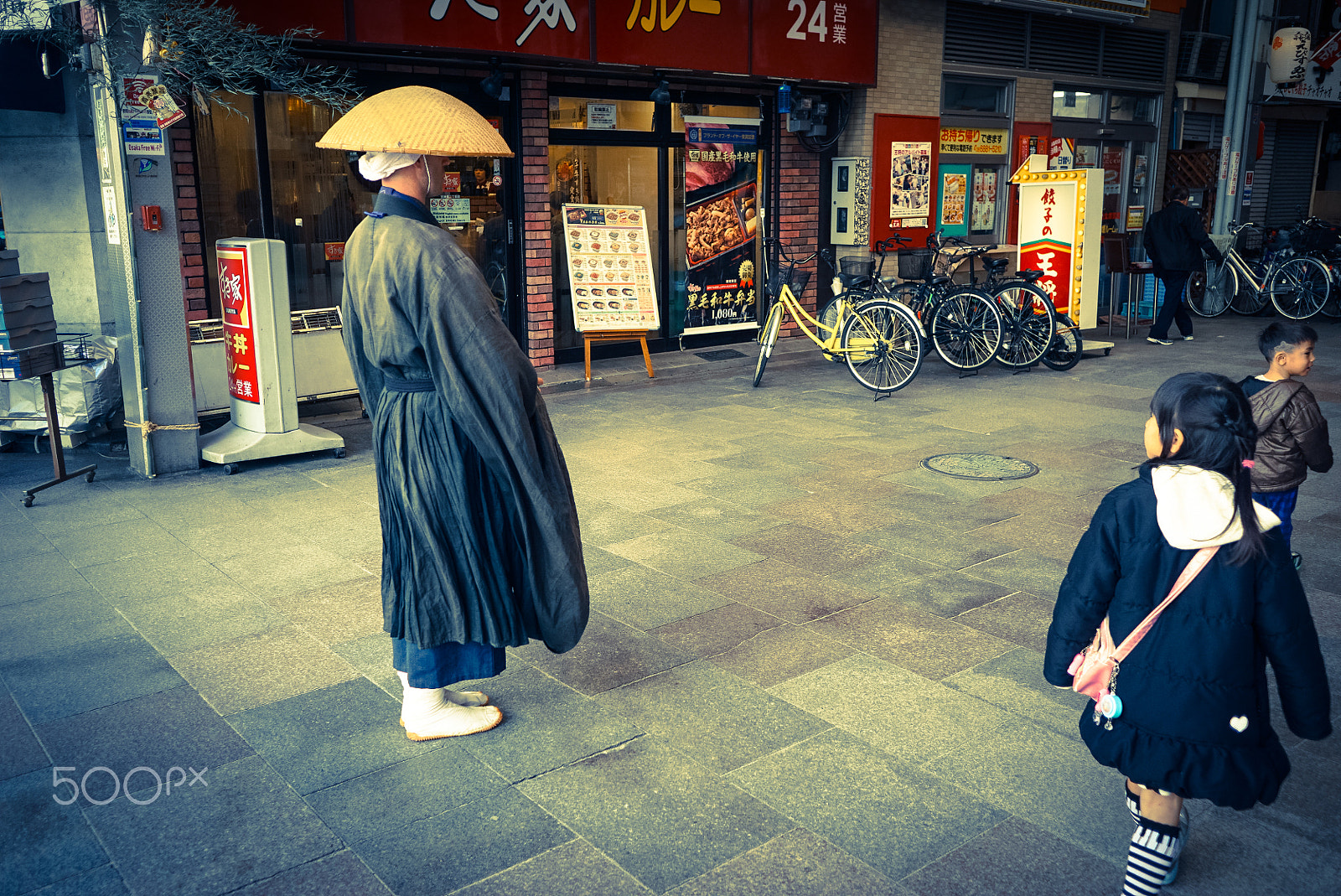 Sony a6000 sample photo. A buddhist on the street photography