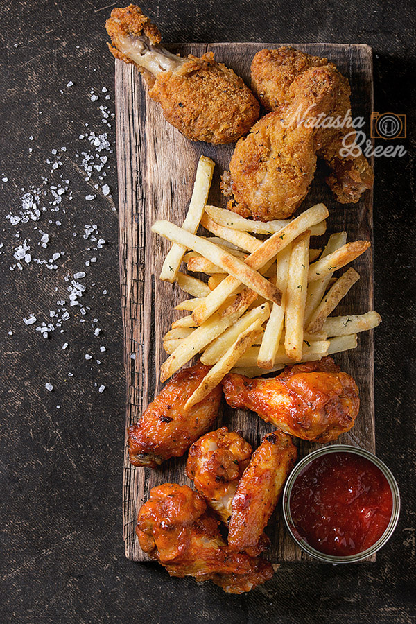 Canon EOS 700D (EOS Rebel T5i / EOS Kiss X7i) + Canon EF 70-200mm F4L IS USM sample photo. Fried chicken legs with french fries photography