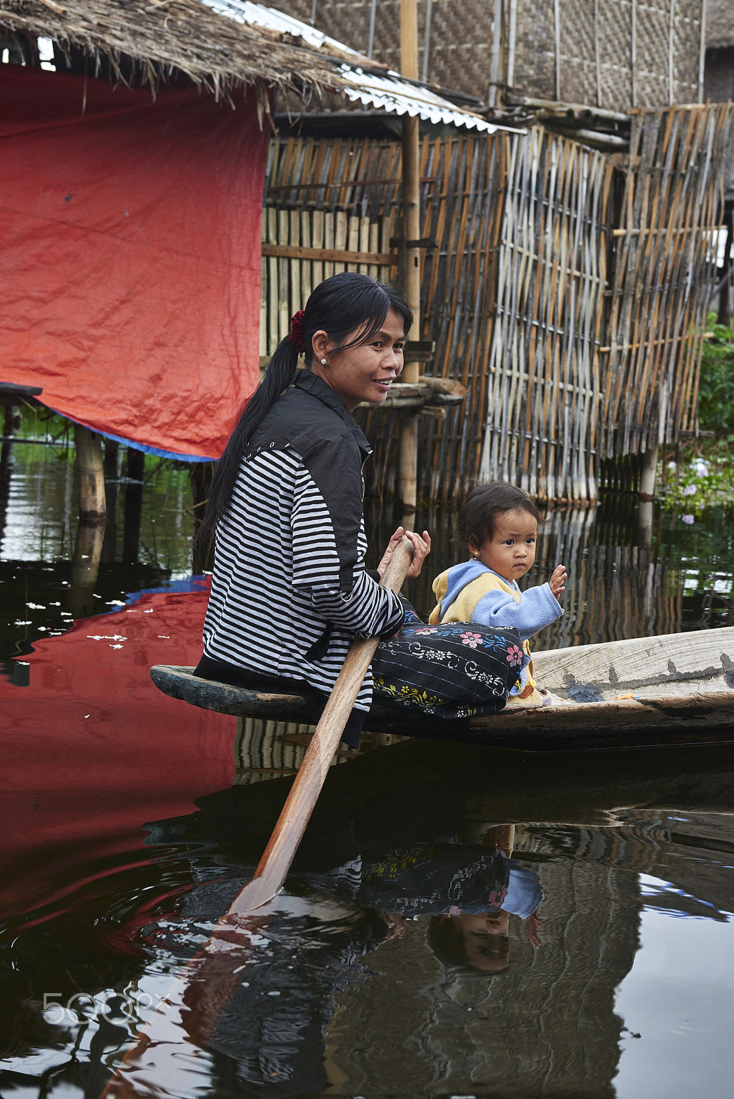 Nikon AF-S Nikkor 24-70mm F2.8G ED sample photo. Mother & child in rowboat photography