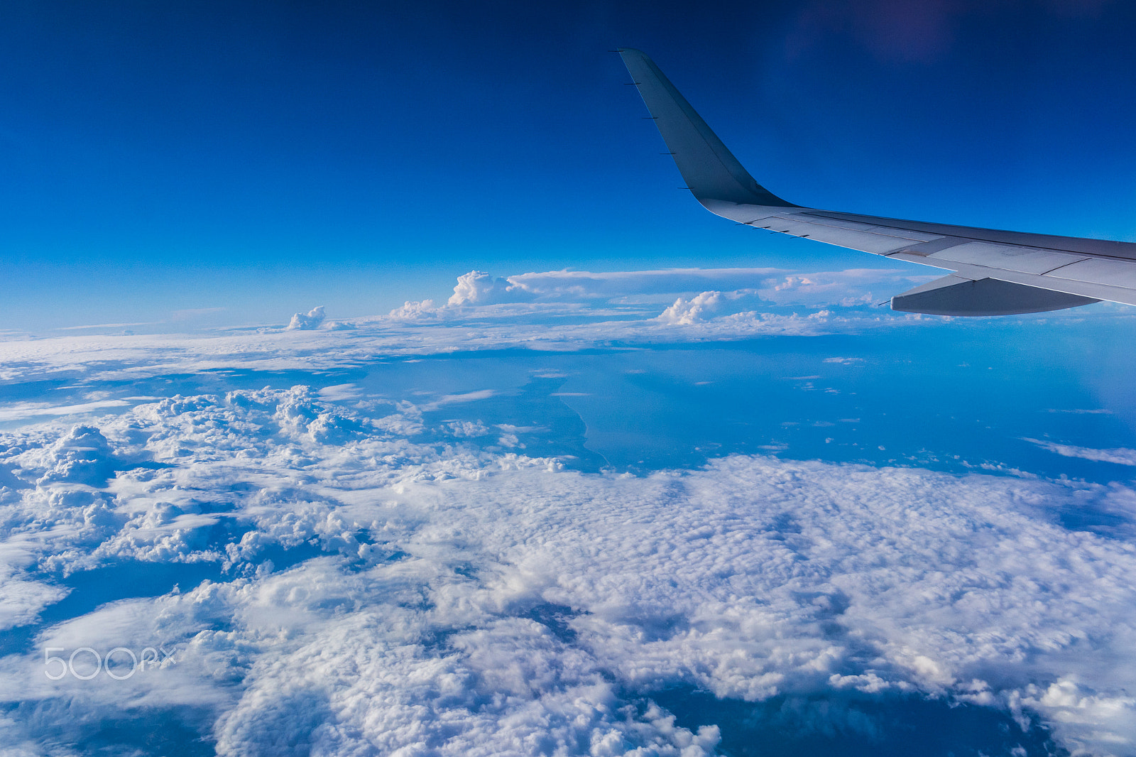 Samsung NX1000 + Samsung NX 20-50mm F3.5-5.6 ED sample photo. Cloud from airplane. white and blue photography