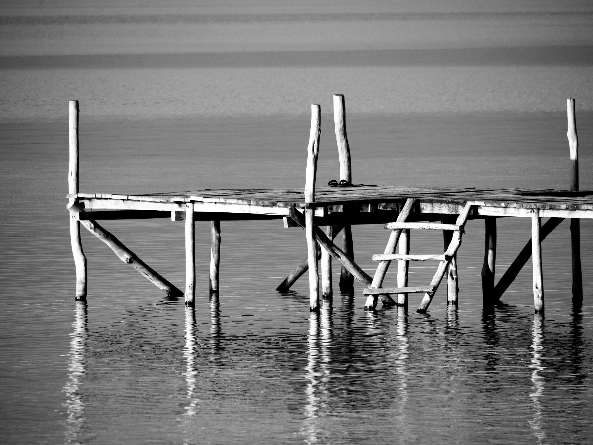 Panasonic Lumix DMC-GX7 sample photo. Jetty into lake petén itza photography