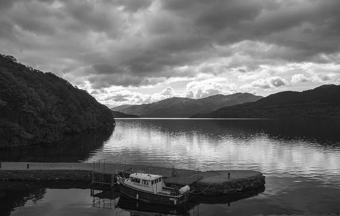 Nikon AF-S Nikkor 28-70mm F2.8 ED-IF sample photo. Jetty and boat moored at inversnaid  - black and white - loch lo photography