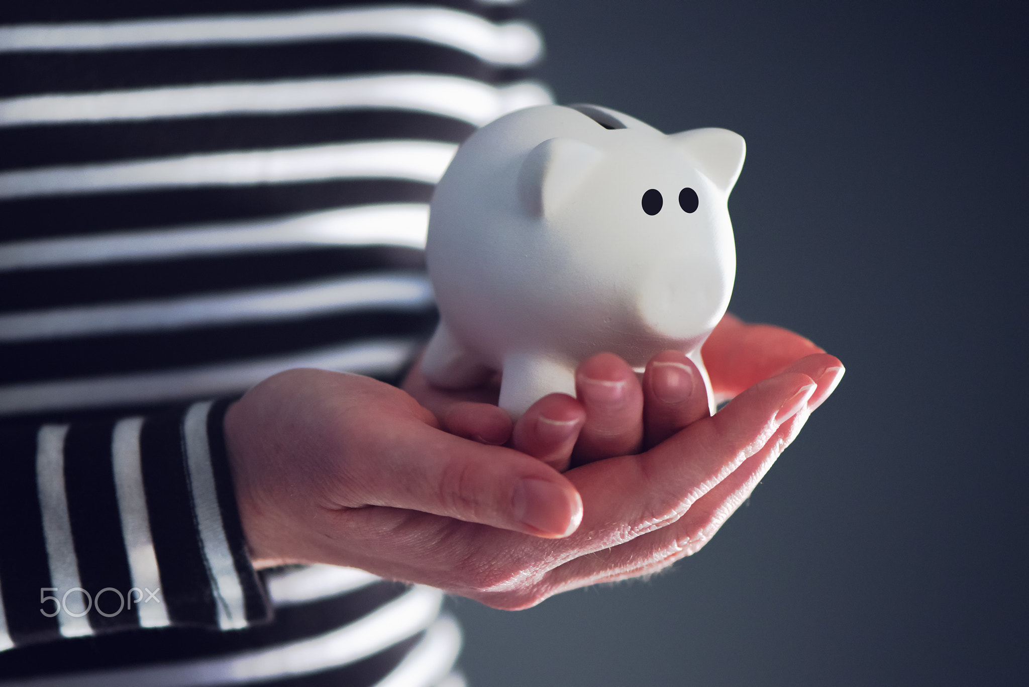 Woman with piggy coin bank