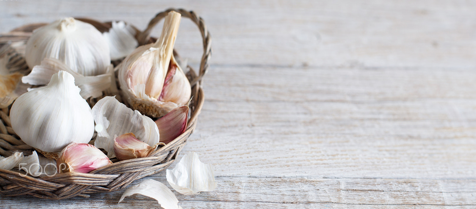 Canon EOS 650D (EOS Rebel T4i / EOS Kiss X6i) + Canon EF 50mm F1.2L USM sample photo. Organic garlic on wooden table photography