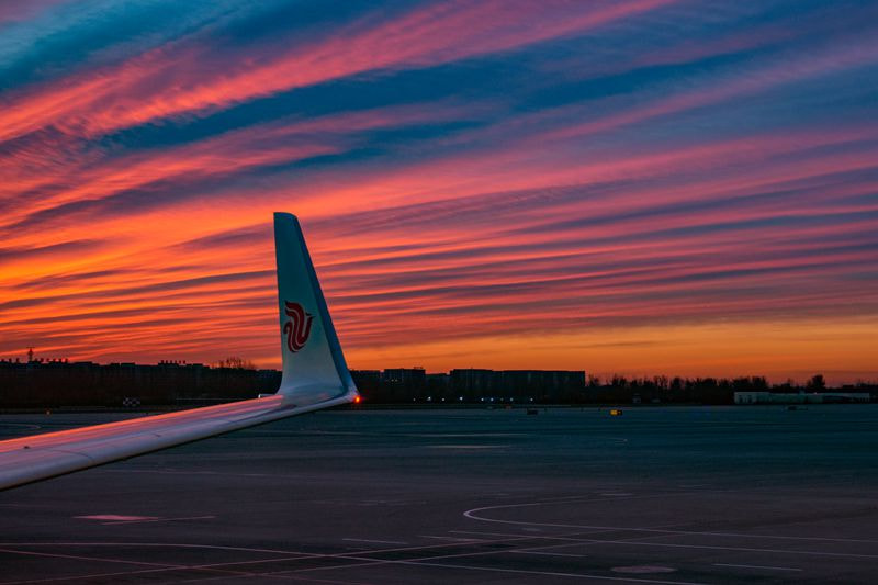 Olympus PEN E-PL5 sample photo. Sunset glow in the airport photography