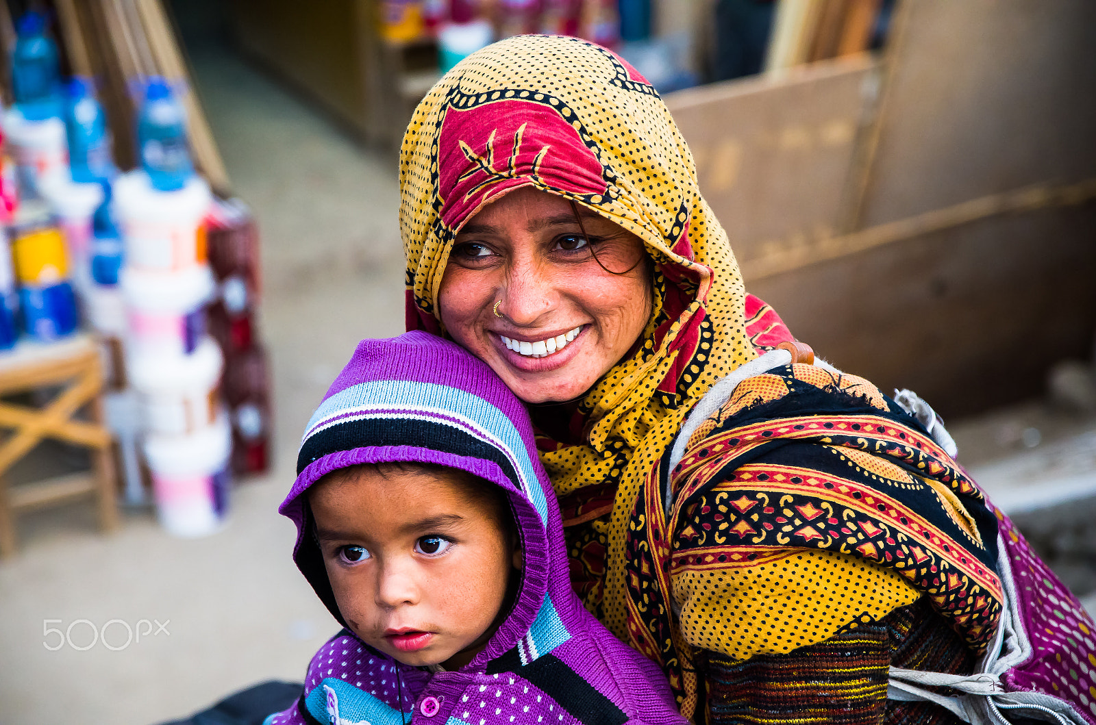 Pentax K-50 sample photo. Mother with her child on the street.jpg photography