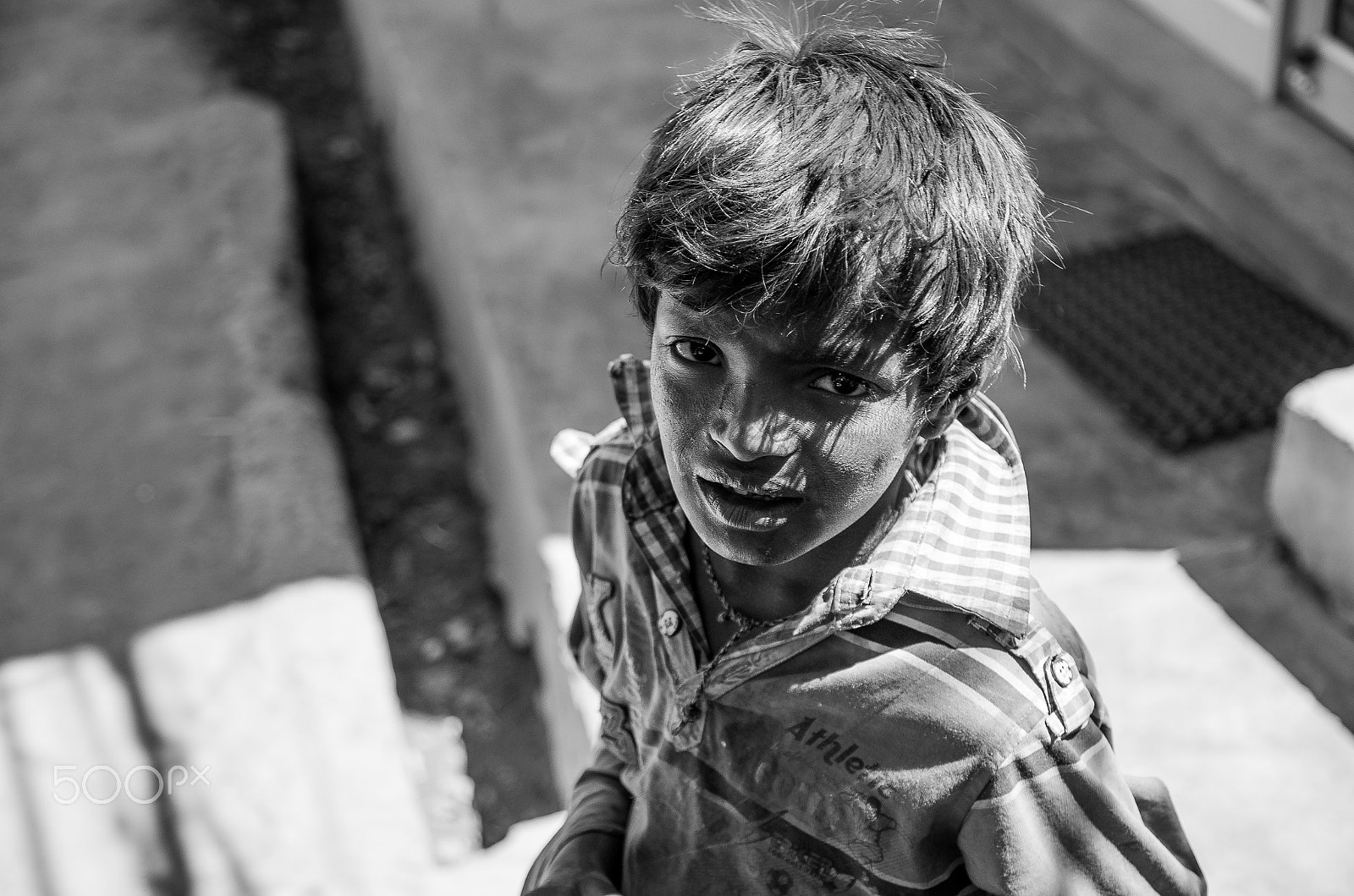 Pentax K-50 + Sigma 17-70mm F2.8-4 DC Macro HSM | C sample photo. Boy on the street.jpg photography