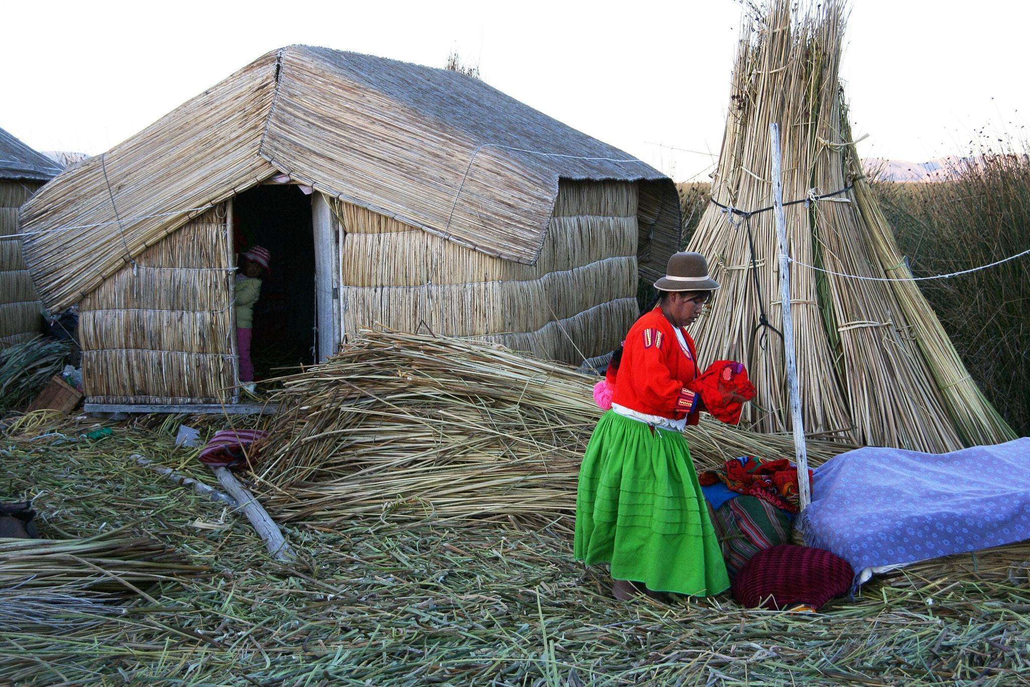 Canon EOS 400D (EOS Digital Rebel XTi / EOS Kiss Digital X) sample photo. The islands of the uros in lago titicaca require constant maintenance to keep them floating photography
