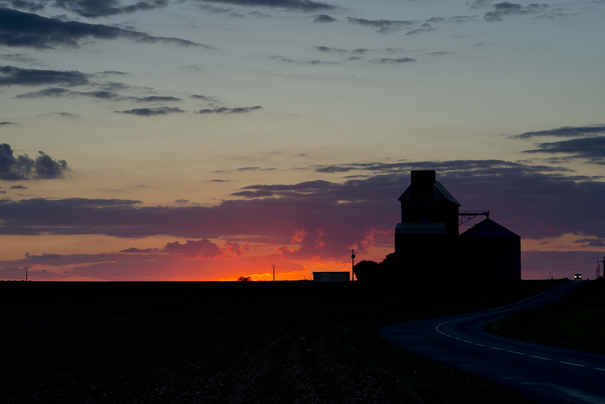 Nikon AF Nikkor 105mm F2D DC sample photo. Sunset angenay, france. got lucky with the car and headlights photography