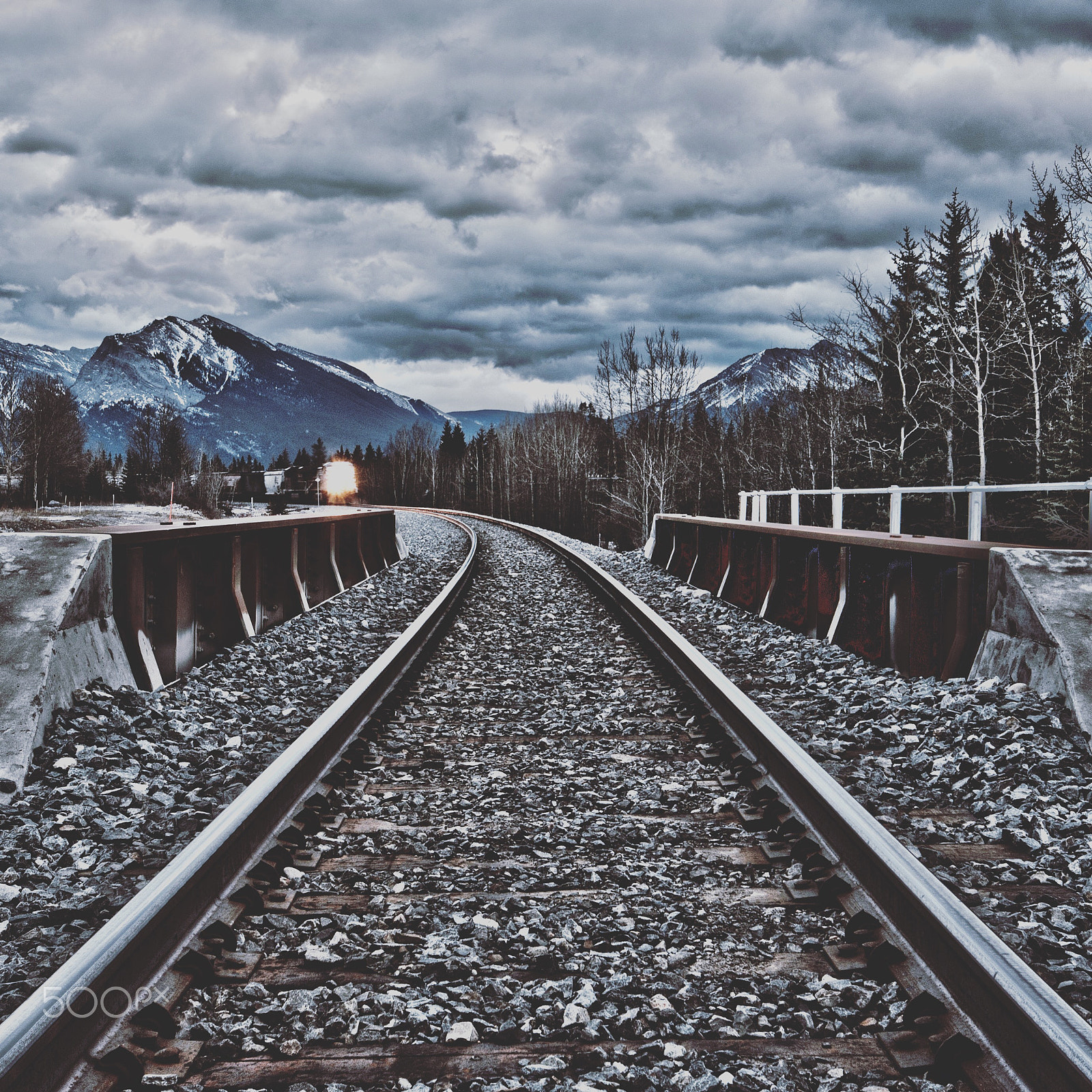 Nikon D300 + Nikon AF-S DX Nikkor 10-24mm F3-5-4.5G ED sample photo. Town of canmore alberta canada on train track and train coming at you photography