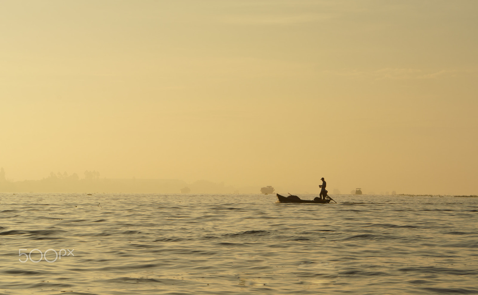 Sony a6000 + ZEISS Batis 85mm F1.8 sample photo. Fishing man at mekong river photography