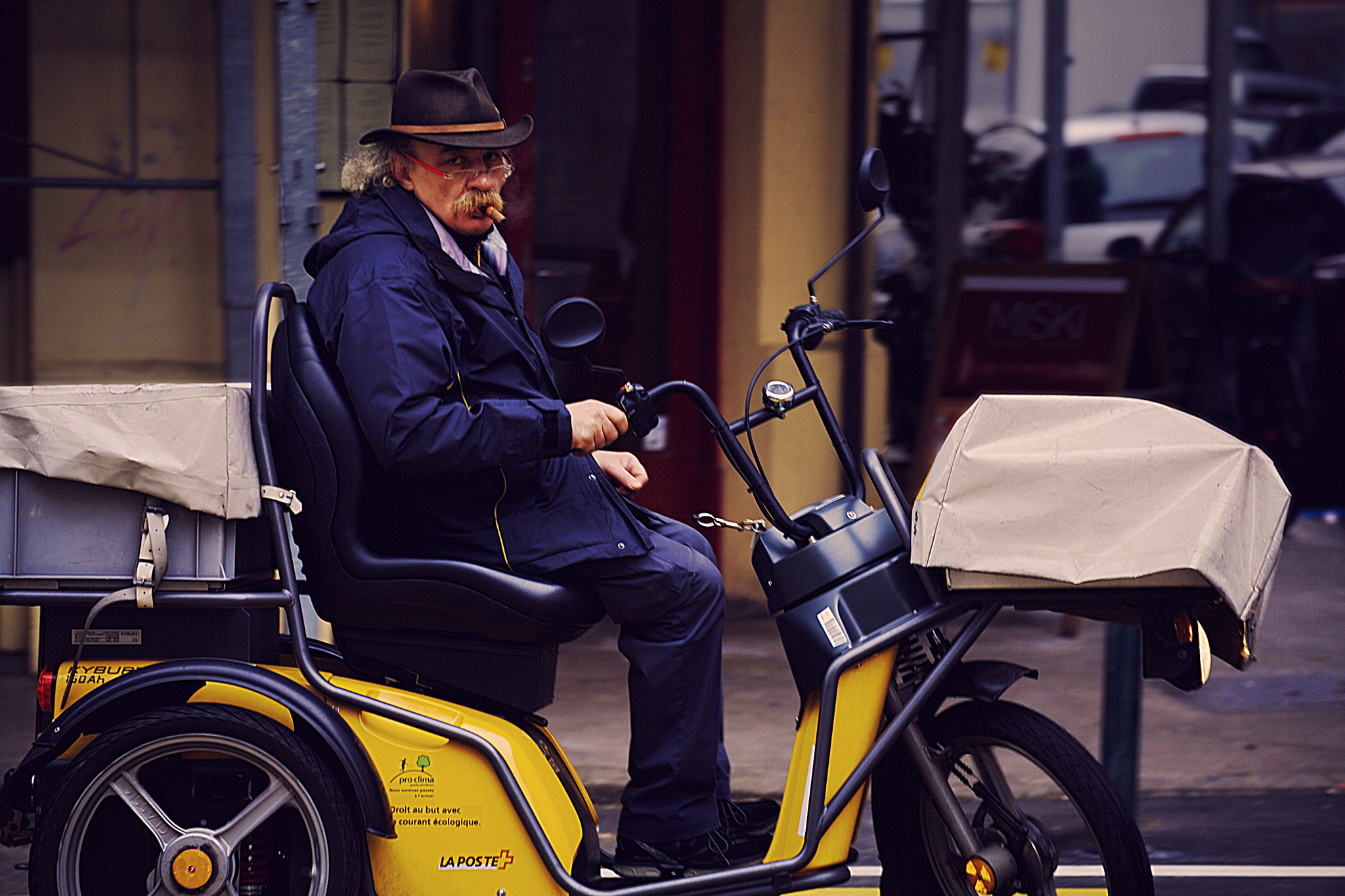 Tamron SP 35mm F1.8 Di VC USD sample photo. Postman with cigare photography