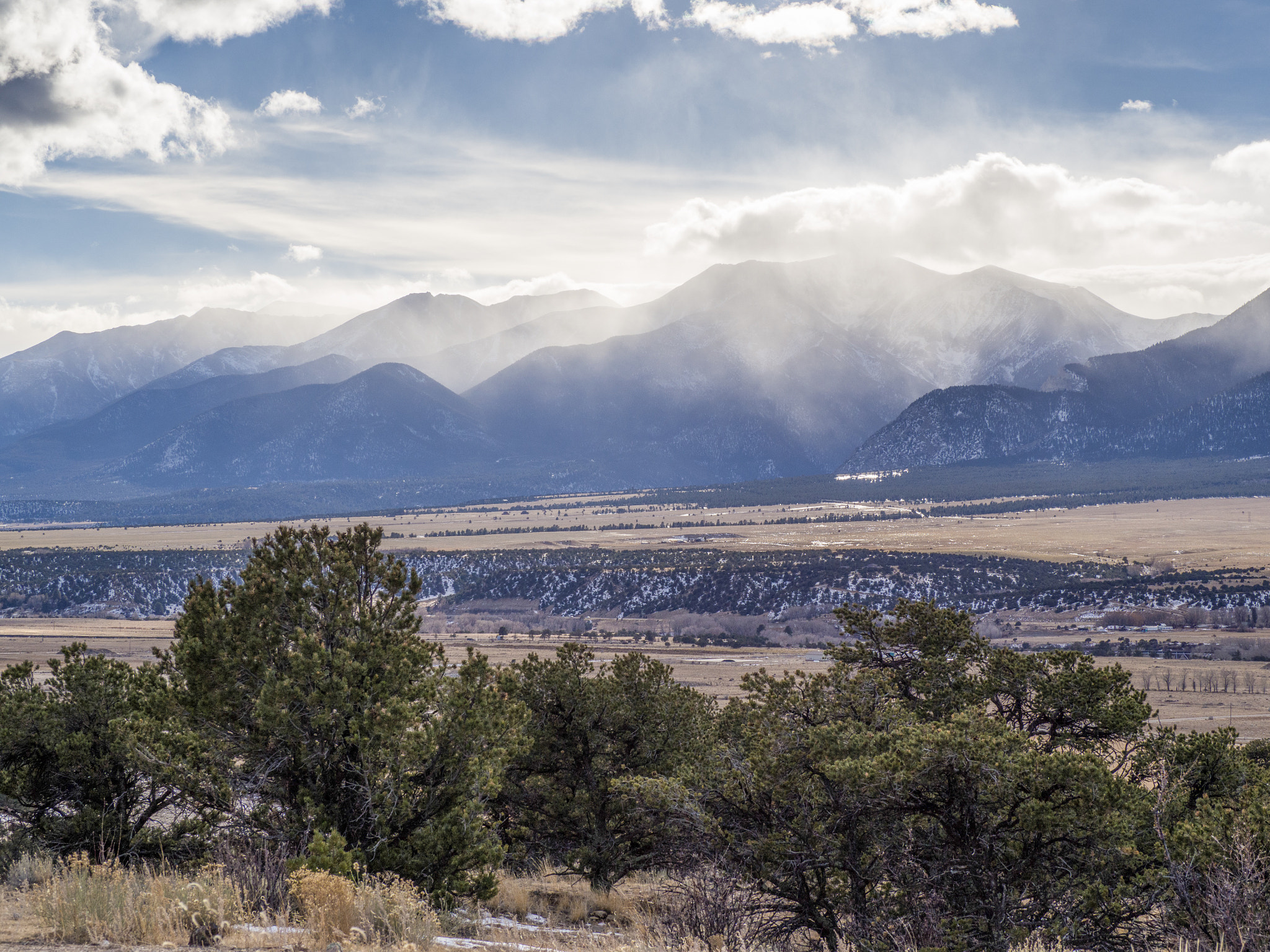 Olympus OM-D E-M10 sample photo. Mountains through the clouds photography