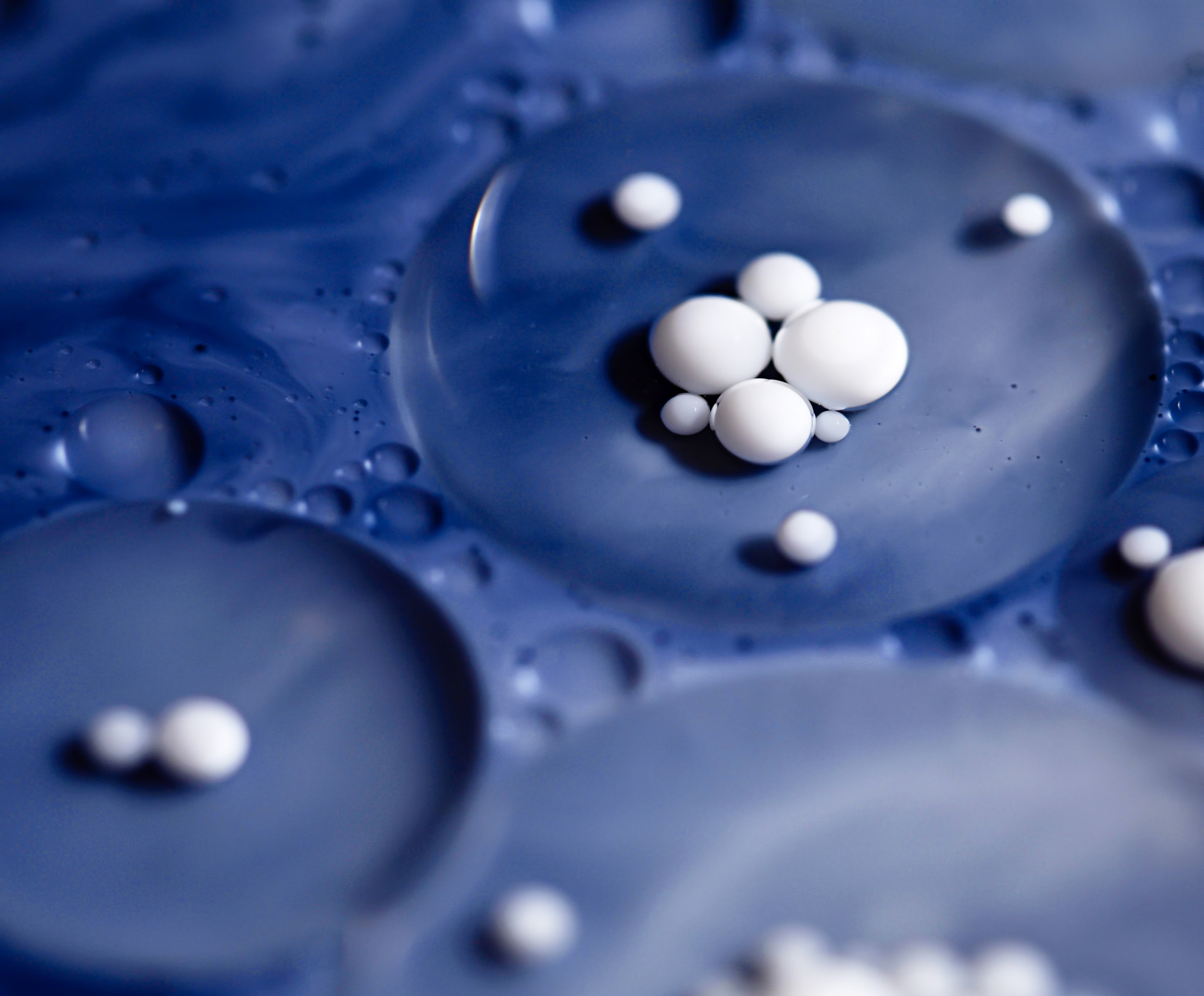 Nikon D5500 sample photo. White balls in the blue oil photography