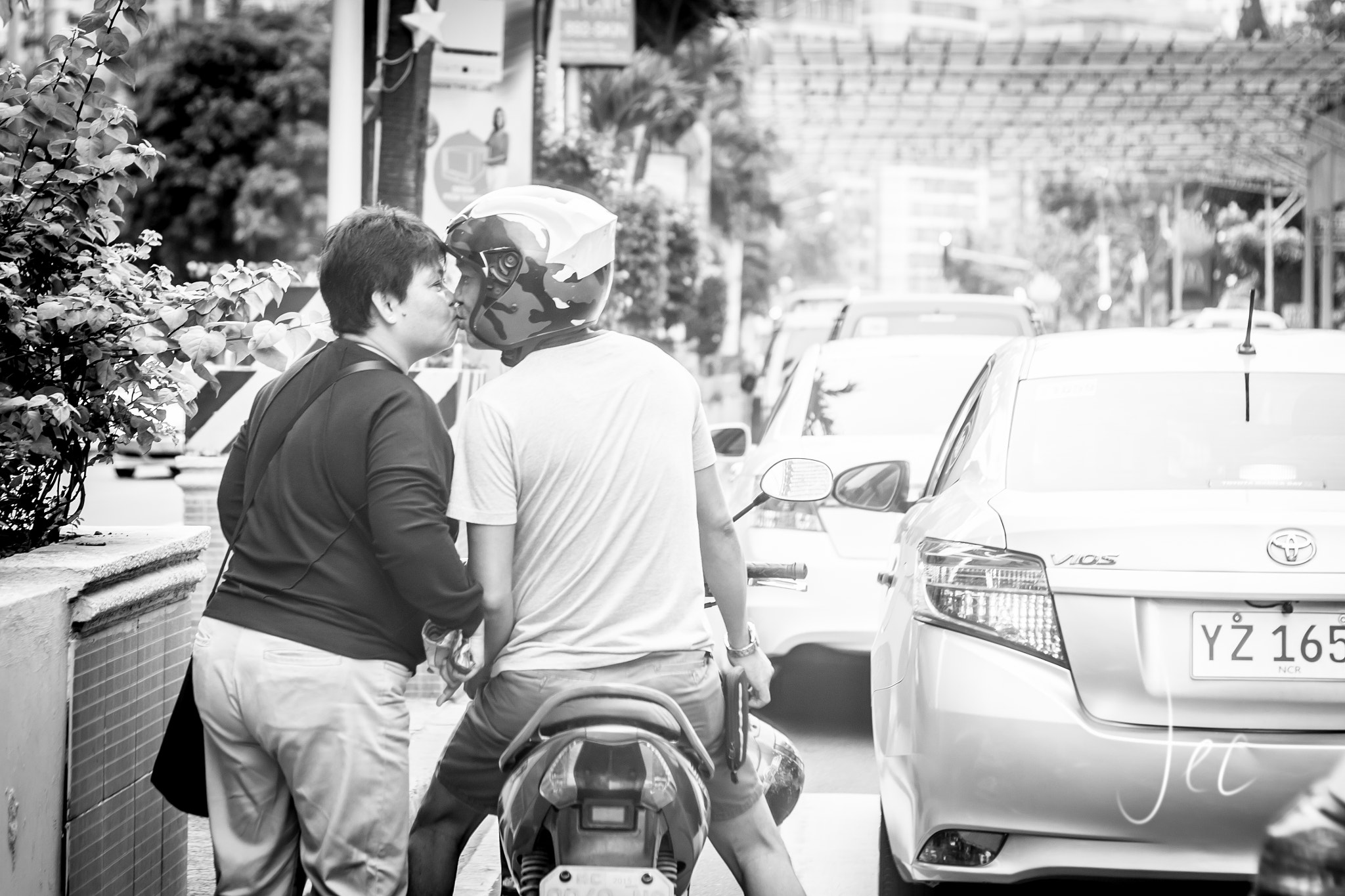 Canon EF 50mm F1.8 II sample photo. A "goodbye for now, see you later" kiss photography