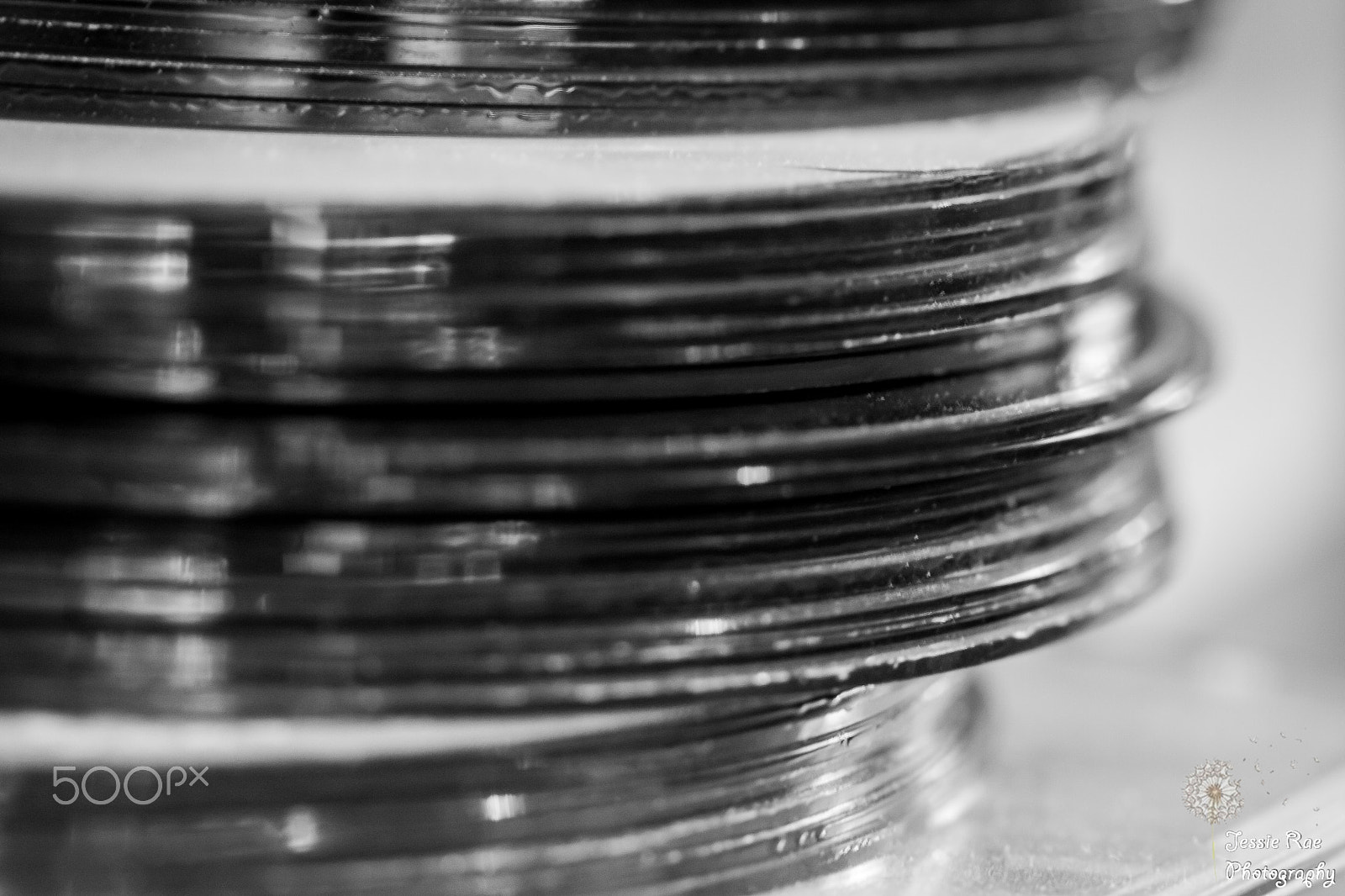 Canon EOS 50D + Canon EF 100mm F2.8L Macro IS USM sample photo. Stack of discs photography