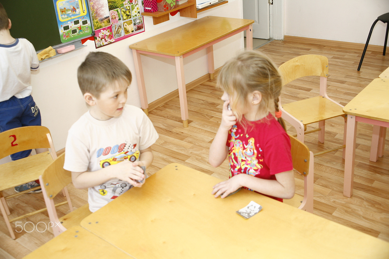 Canon EOS 5D sample photo. Moscow, russia-april 17, 2014: children play with toys and engage  the tutor in a kindergarten photography