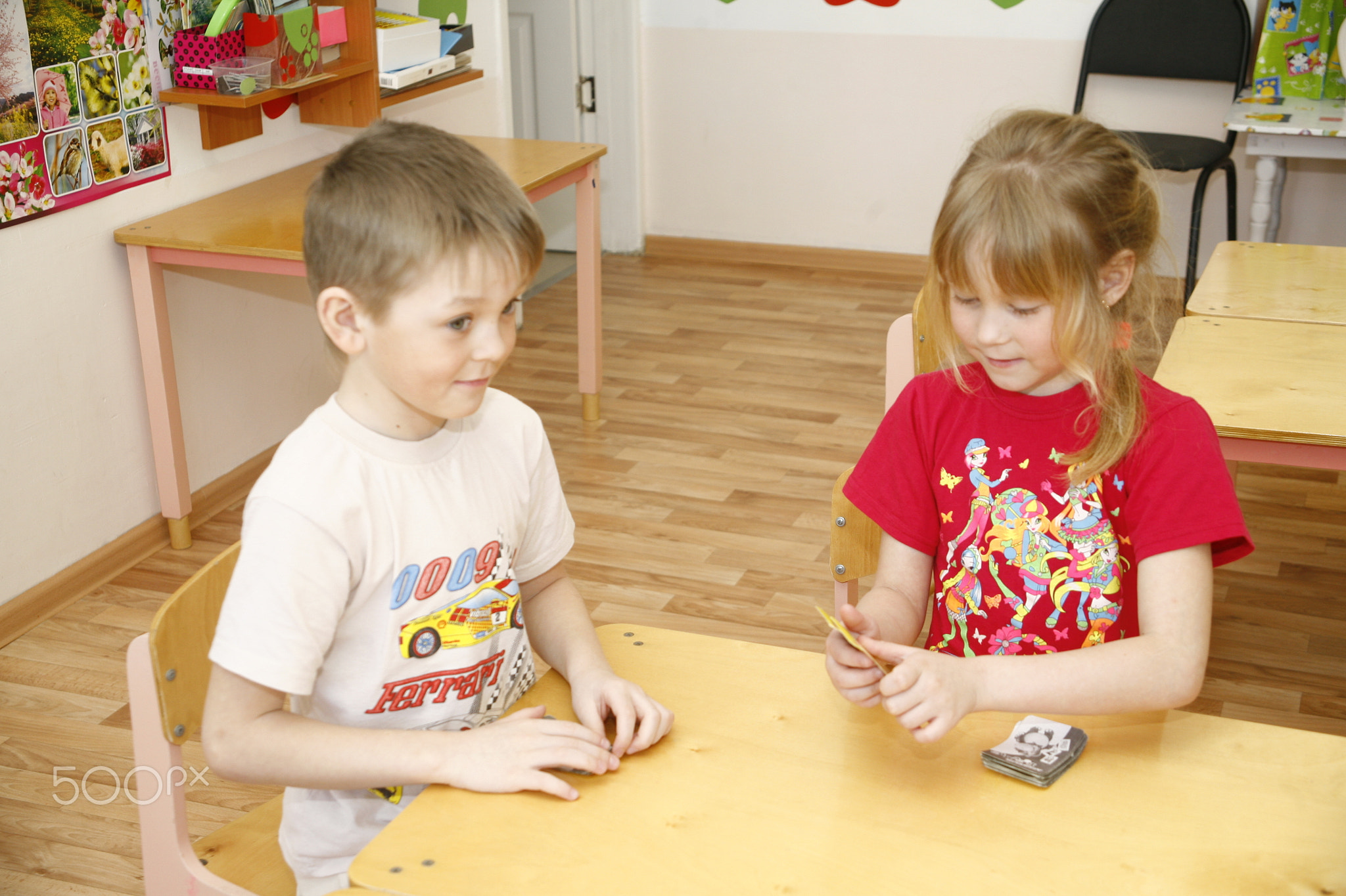 MOSCOW, RUSSIA-APRIL 17, 2014: children play with toys and engage  the tutor in a kindergarten