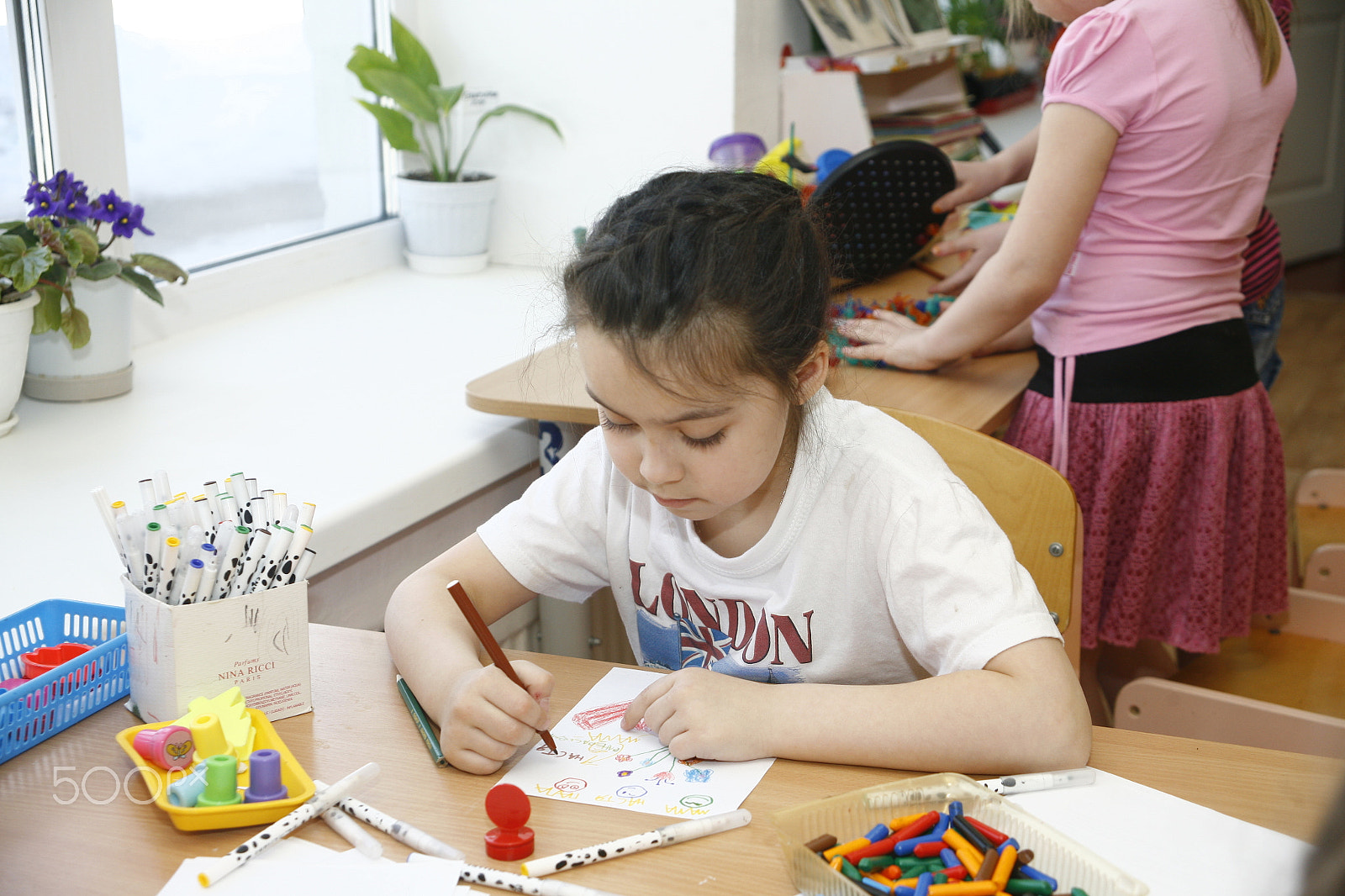 Canon EF 28-105mm f/3.5-4.5 USM sample photo. Moscow, russia-april 17, 2014: children play with toys and engage  the tutor in a kindergarten photography