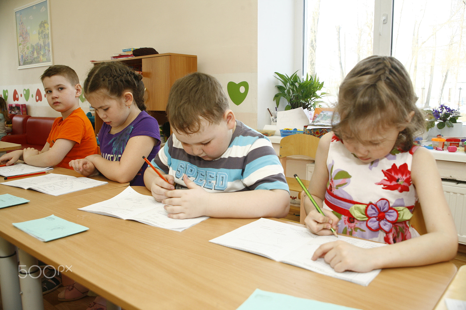 Canon EF 28-105mm f/3.5-4.5 USM sample photo. Moscow, russia-april 17, 2014: children play with toys and engage  the tutor in a kindergarten photography
