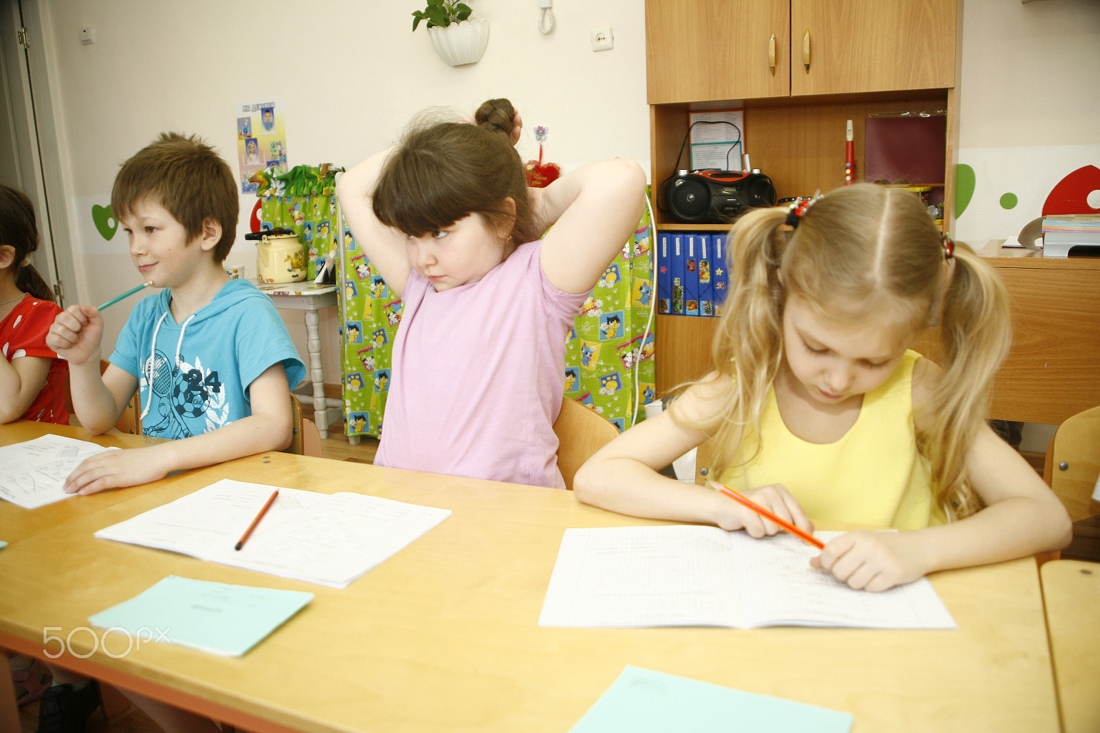 Canon EF 28-105mm f/3.5-4.5 USM sample photo. Moscow, russia-april 17, 2014: children play with toys and engage  the tutor in a kindergarten photography