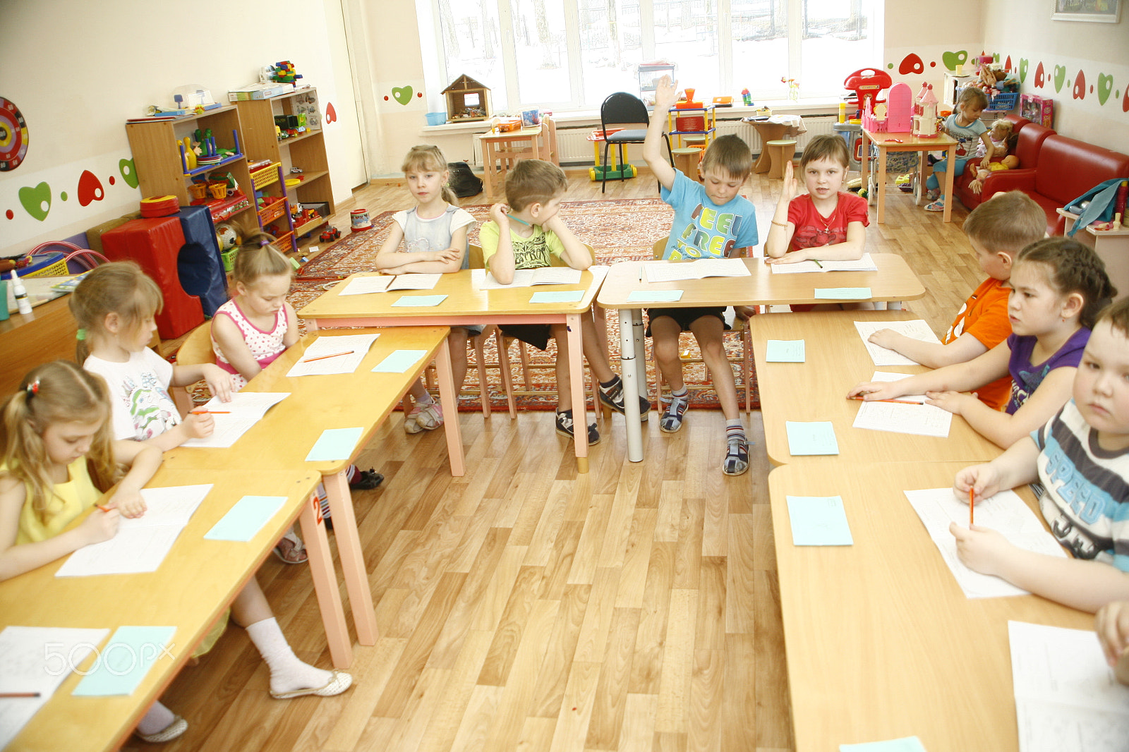 Canon EF 28-105mm f/3.5-4.5 USM sample photo. Moscow, russia-april 17, 2014: children play with toys and engage  the tutor in a kindergarten photography