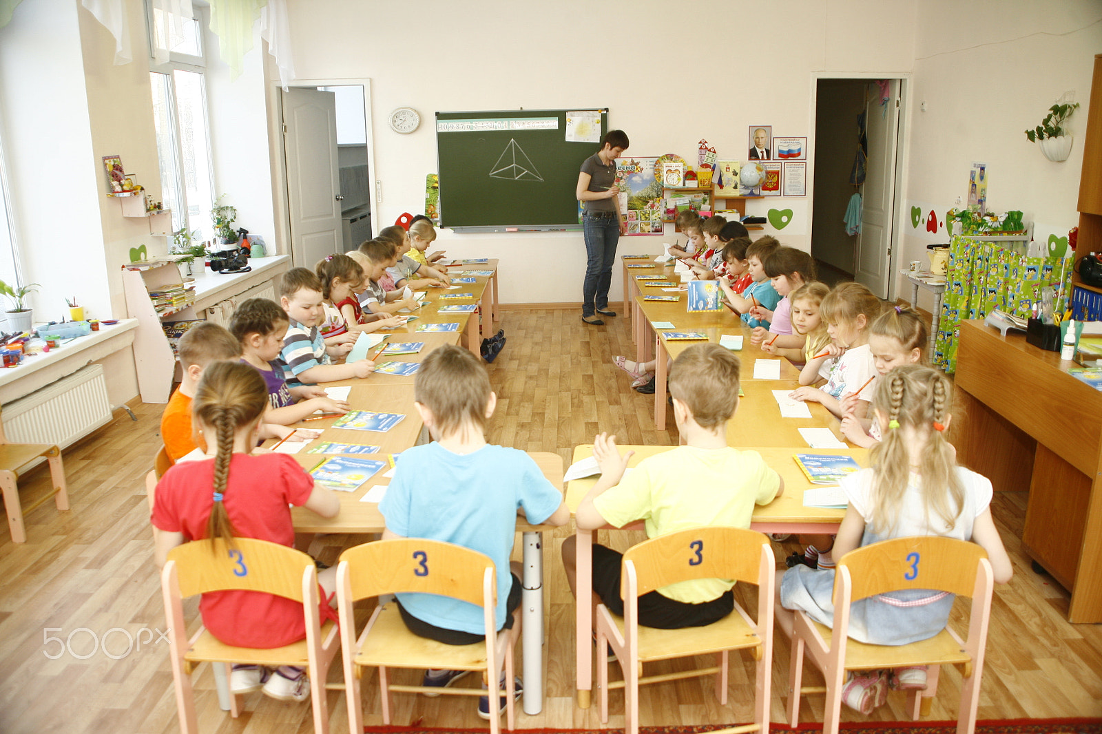 Canon EF 28-105mm f/3.5-4.5 USM sample photo. Moscow, russia-april 17, 2014: children play with toys and engage  the tutor in a kindergarten photography