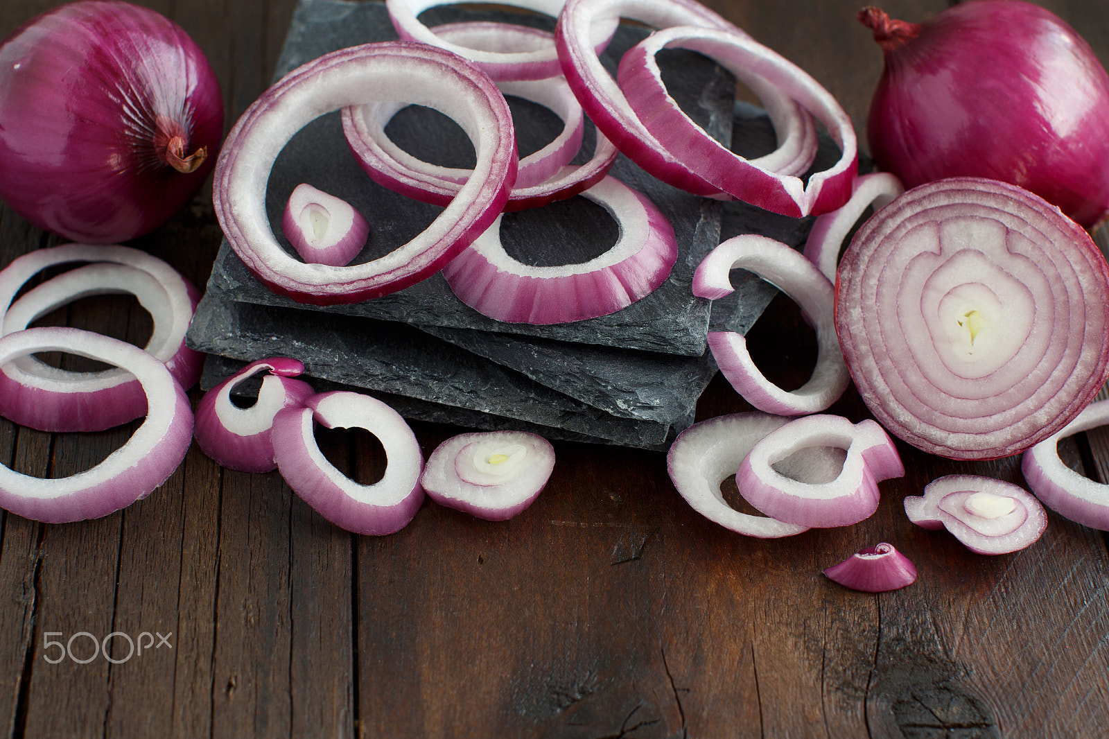 Canon EOS 650D (EOS Rebel T4i / EOS Kiss X6i) + Canon EF 50mm F1.2L USM sample photo. Red onions on a wooden table photography