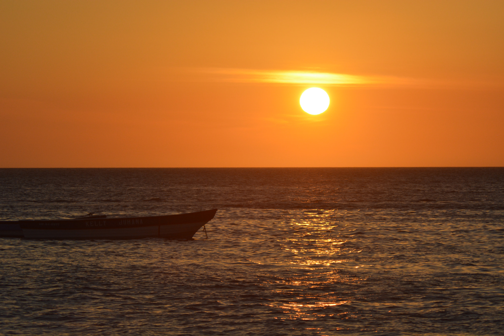 Nikon AF Nikkor 70-300mm F4-5.6G sample photo. Boat at sunset photography