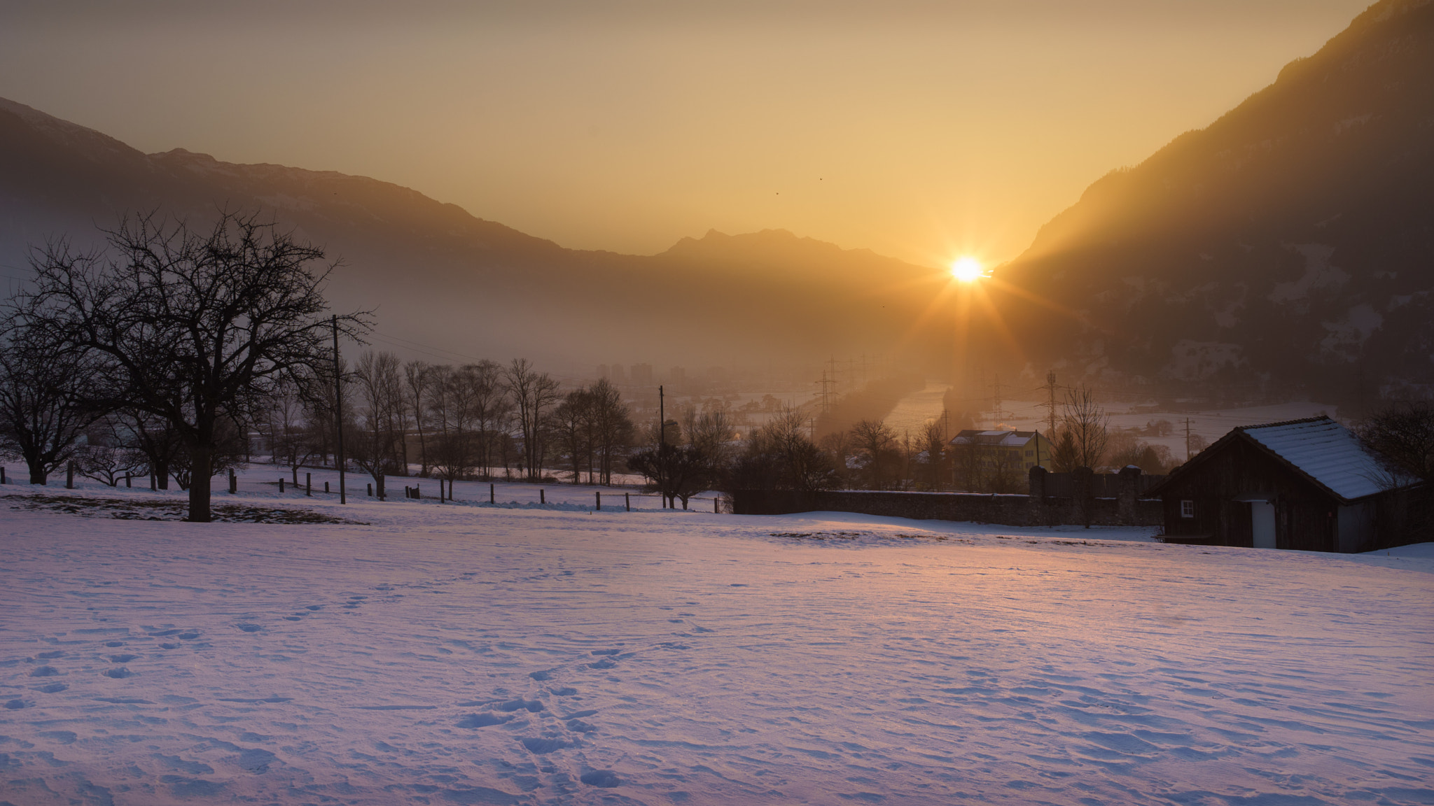 E 35mm F2 sample photo. Sunset over foggy town photography