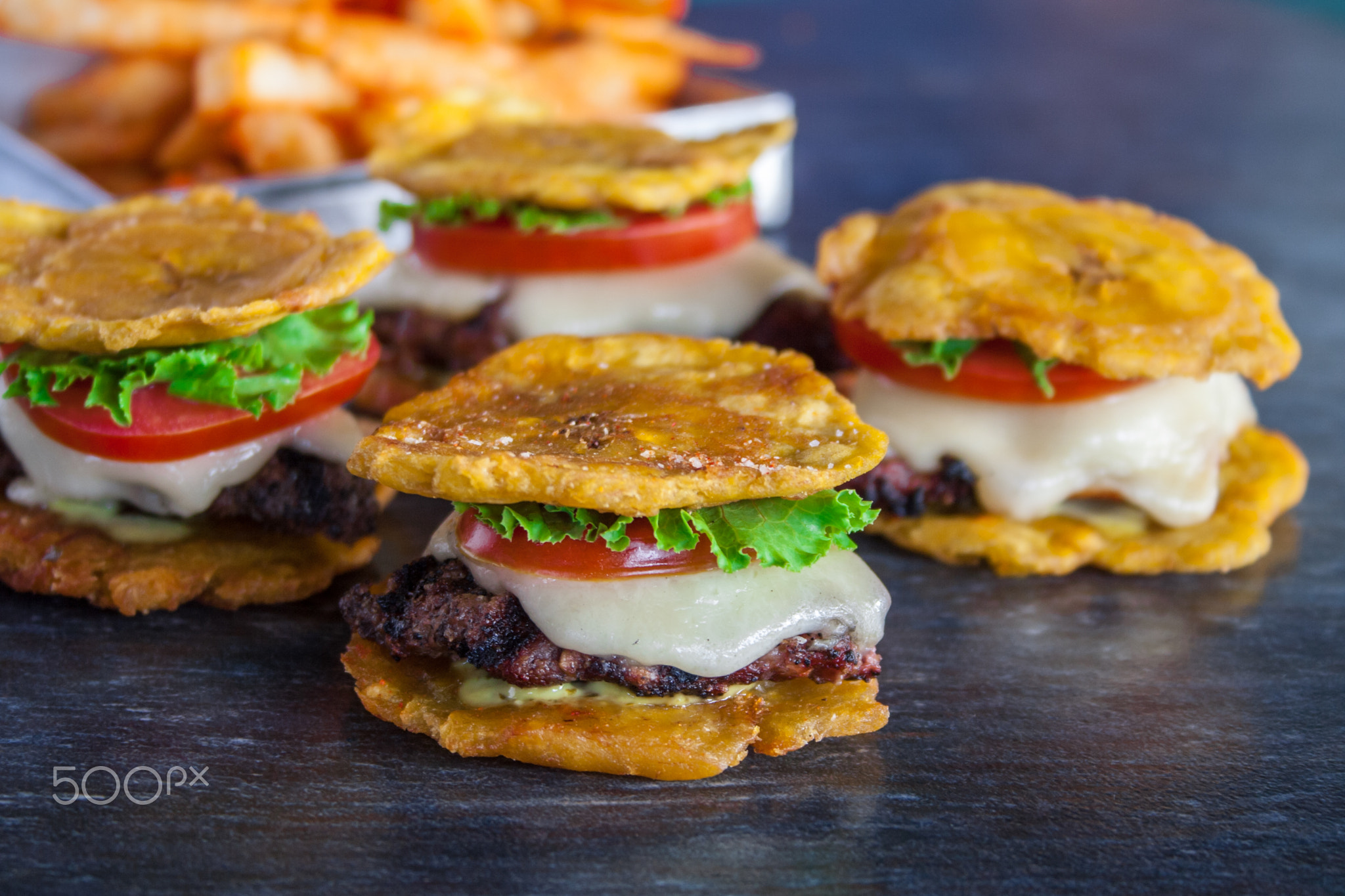 Tostones burger with tomato and cheese