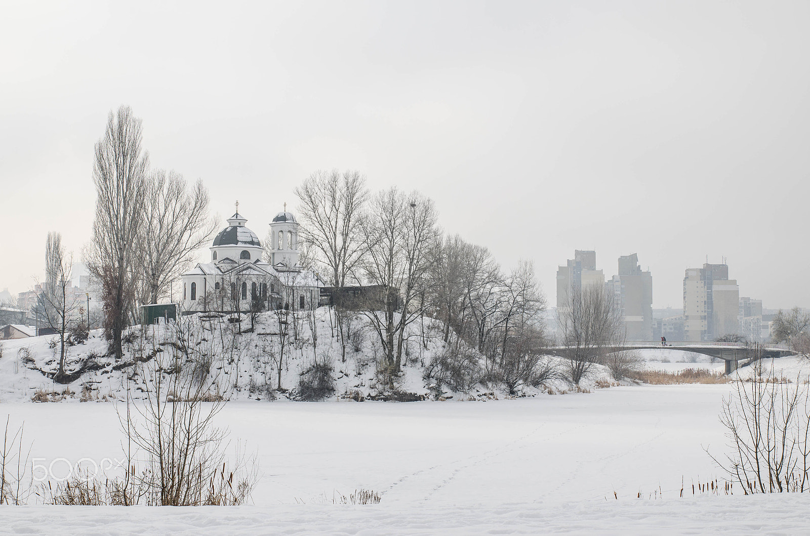 Nikon D5100 + Tamron SP AF 17-50mm F2.8 XR Di II VC LD Aspherical (IF) sample photo. Church on a hill above frozen lake photography