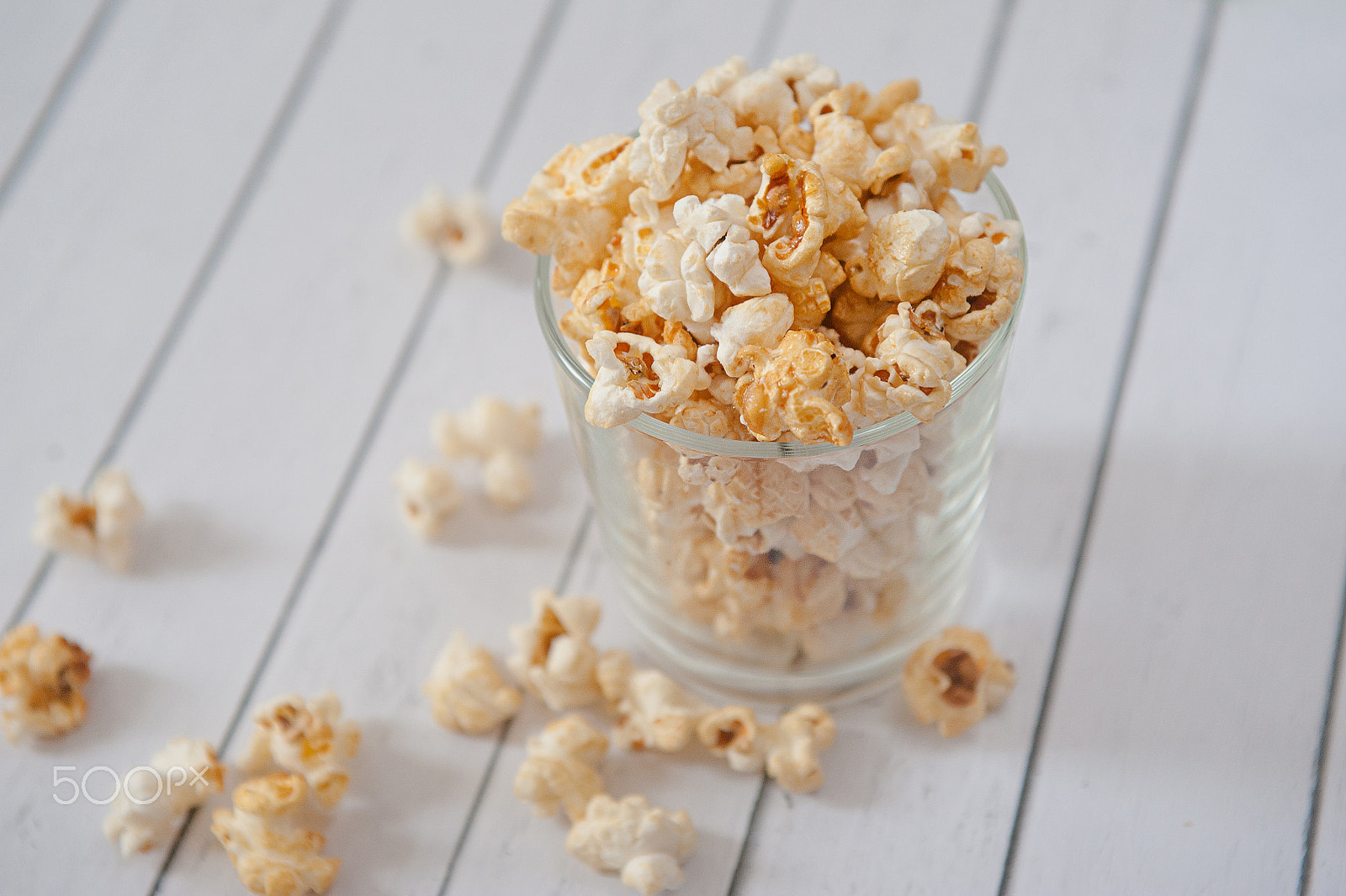 Nikon D700 sample photo. Popcorn in glass cup on white background photography