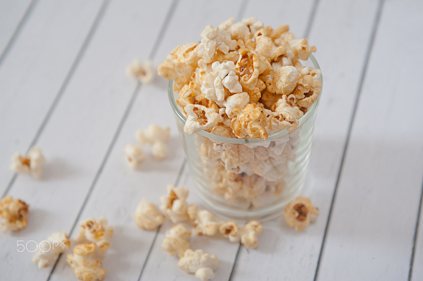 Nikon D700 + Sigma 24-70mm F2.8 EX DG Macro sample photo. Popcorn in glass cup on white background photography