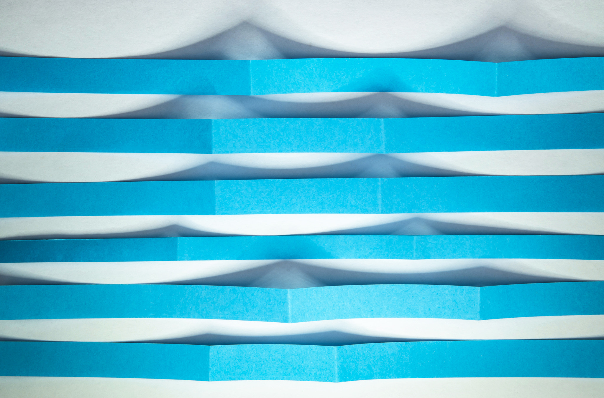 Nikon D5500 sample photo. Blue paper strips as ripples photography