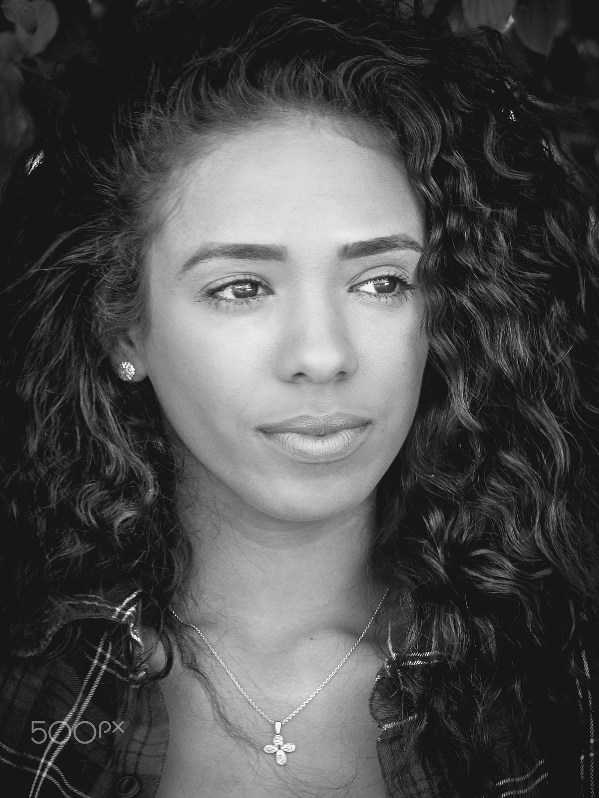 Panasonic Lumix DMC-GH3 sample photo. Black and white portrait of latin woman looking at right photography
