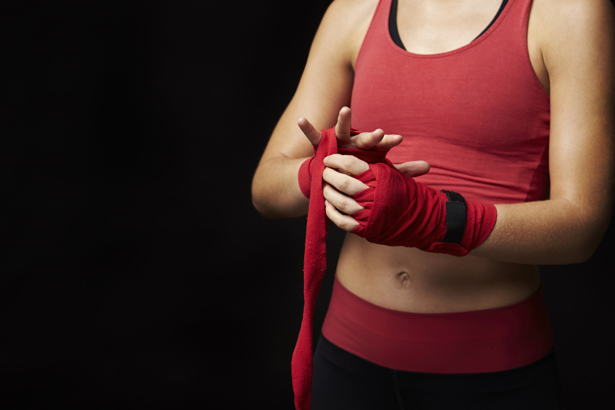 Canon EOS-1D X sample photo. Mid-section of woman wrapping hand for boxing training photography