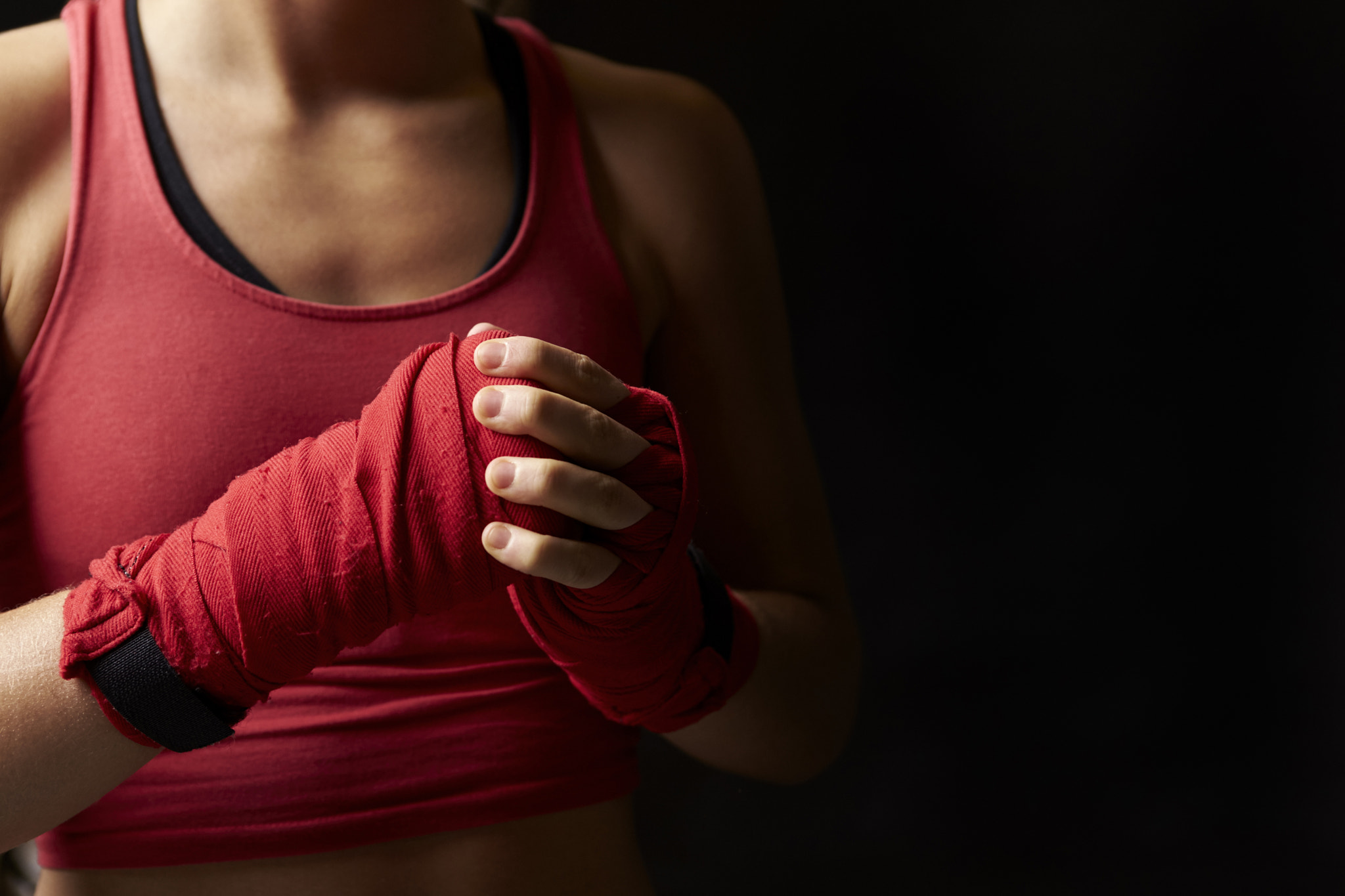 Canon EOS-1D X sample photo. Woman with fists wrapped in preparation for boxing training photography