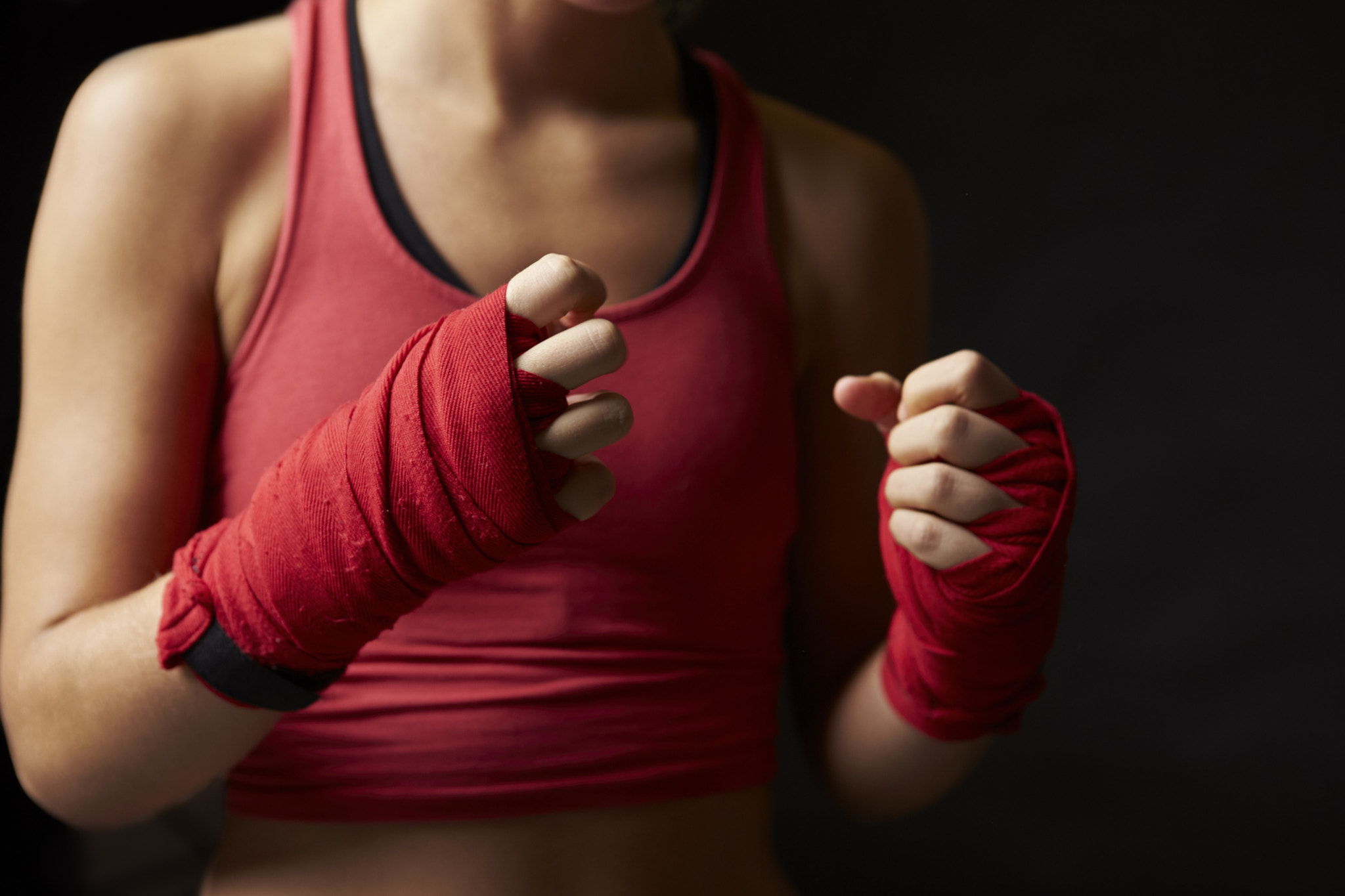 Canon EOS-1D X sample photo. Woman with fists wrapped in preparation for boxing training photography