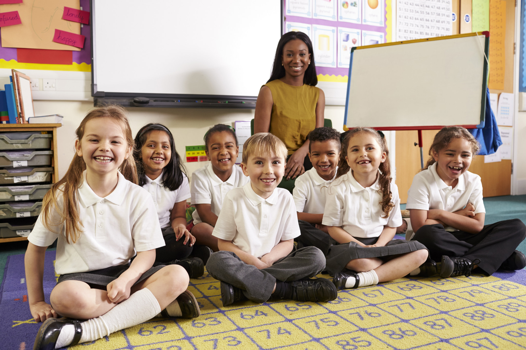 Portrait Of Pupils And Teacher In Elementary Maths Class